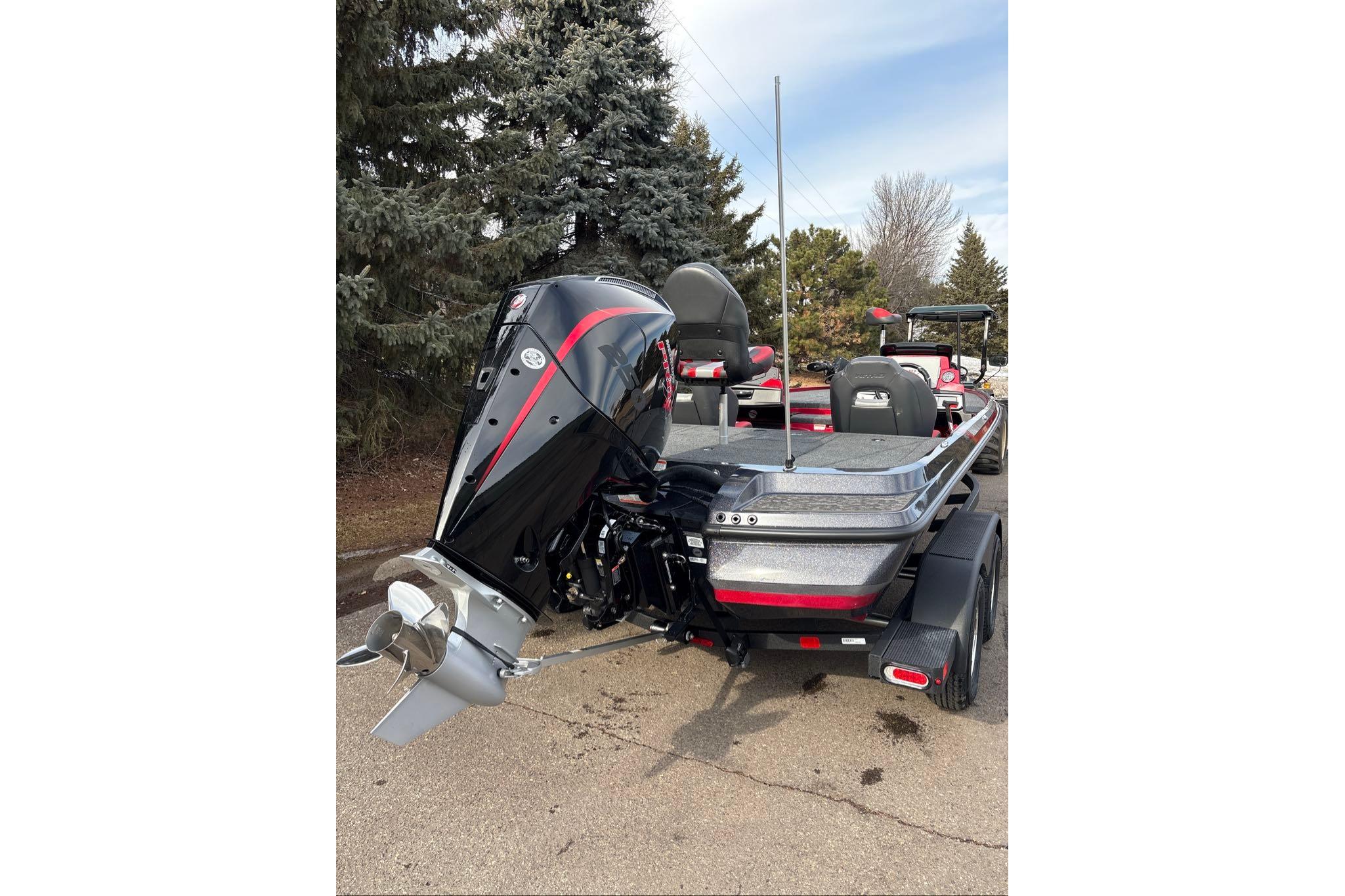 2026 Nitro Z20 XL Pro boat with powerful outboard motor, parked outdoors.