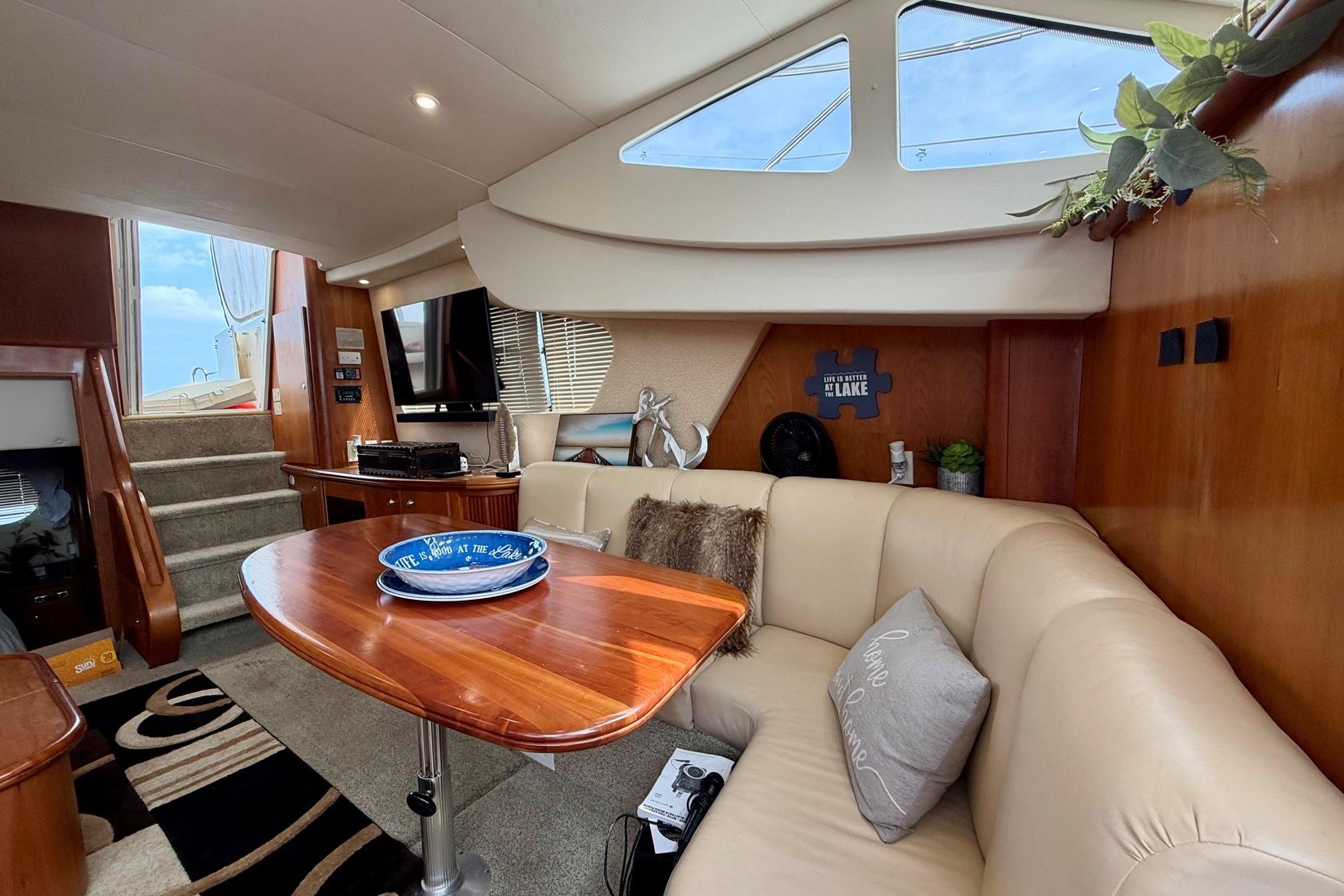 Luxurious interior of 2004 Silverton 39 Motor Yacht with elegant seating and decor.