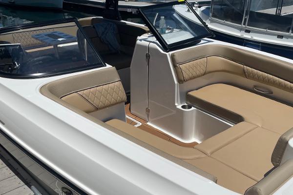 2024 Bayliner DX 2250 boat interior with beige seating and modern design.