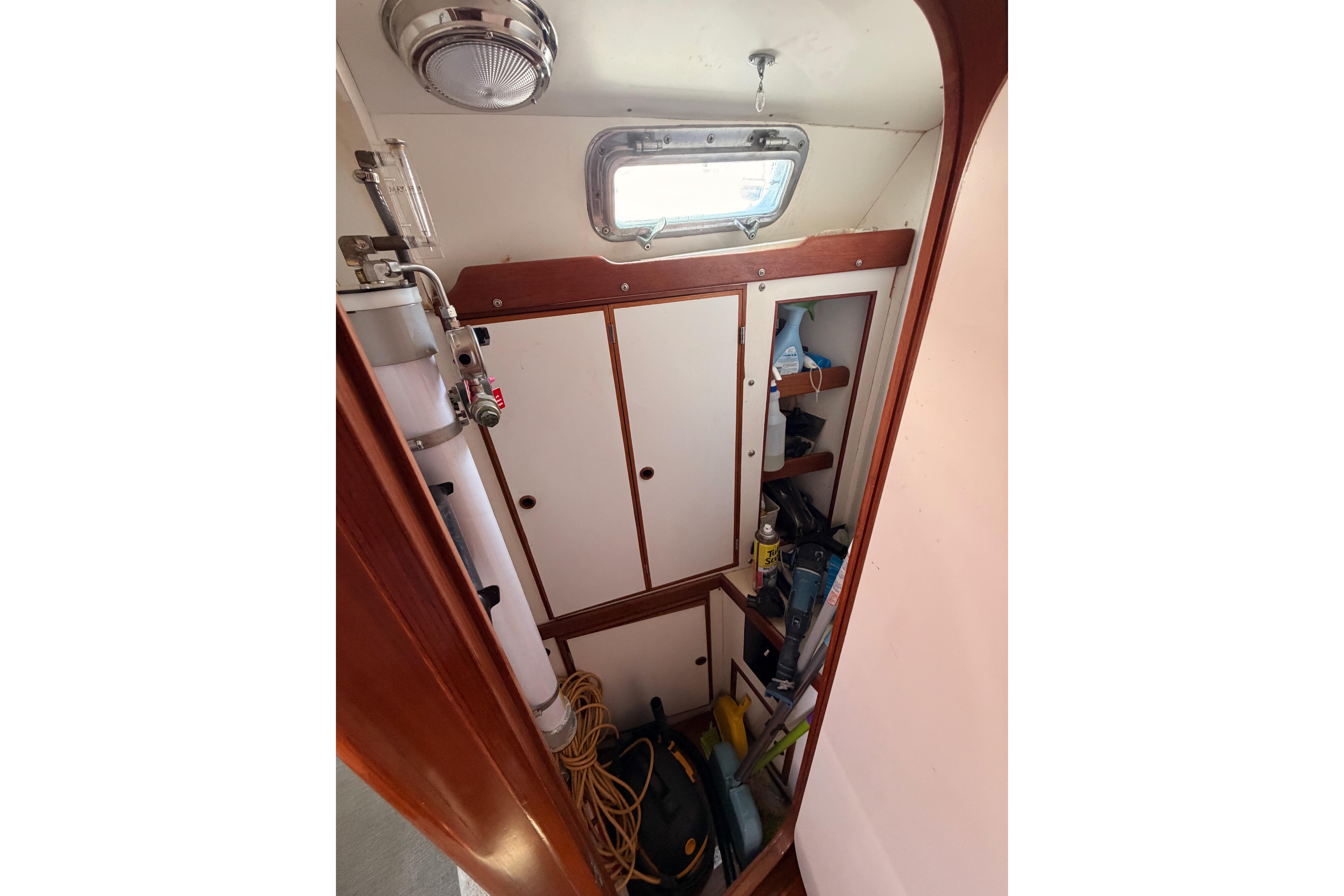 Interior storage area of a 1991 Hylas 51 yacht with shelves and equipment.