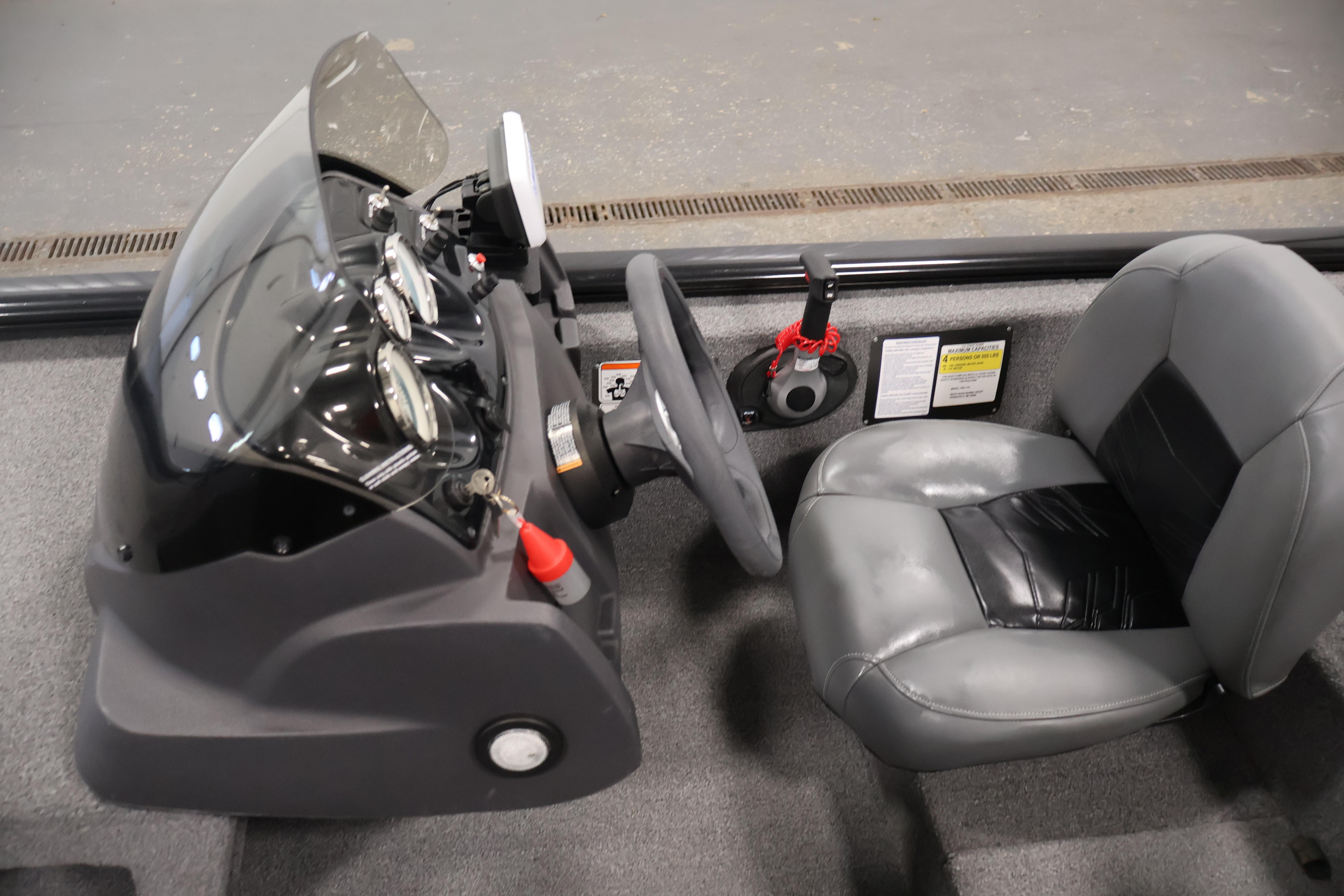 2024 Tracker Pro 170 boat interior with steering console and seat.