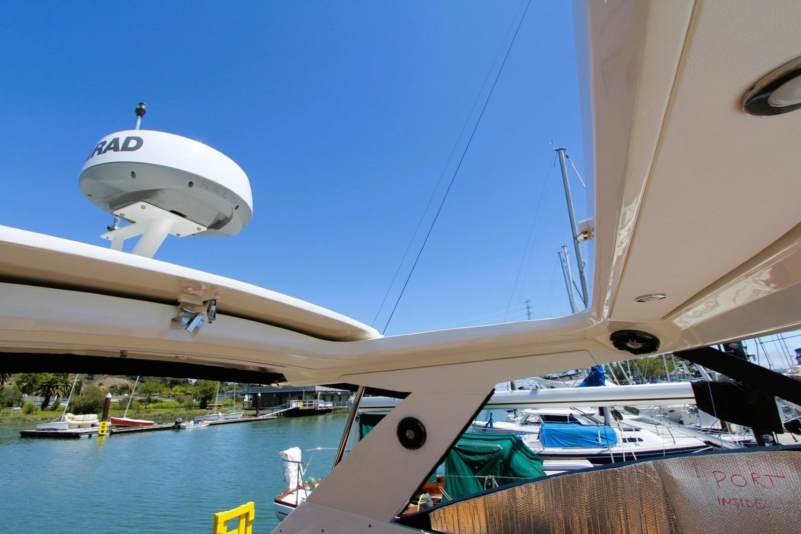 2021 Sea Ray Sundancer 320 Outboard radar system with marina background.