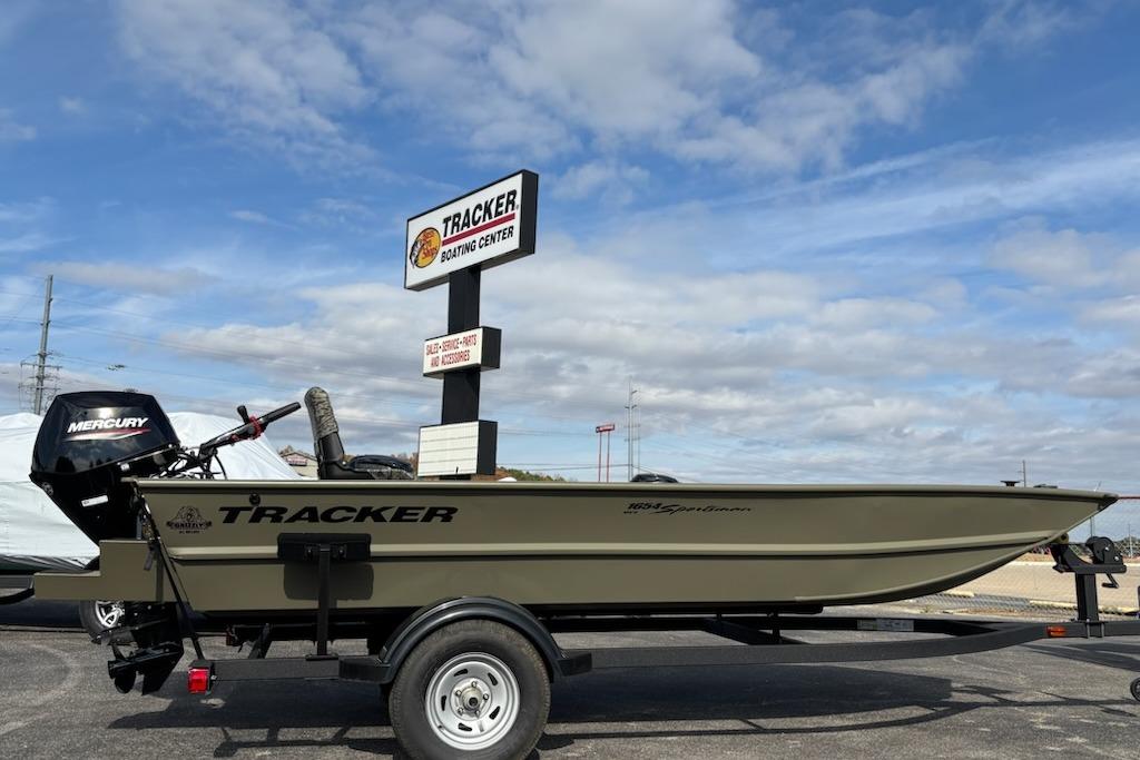 2026 Tracker Grizzly 1654 T Sportsman boat on trailer at dealership.