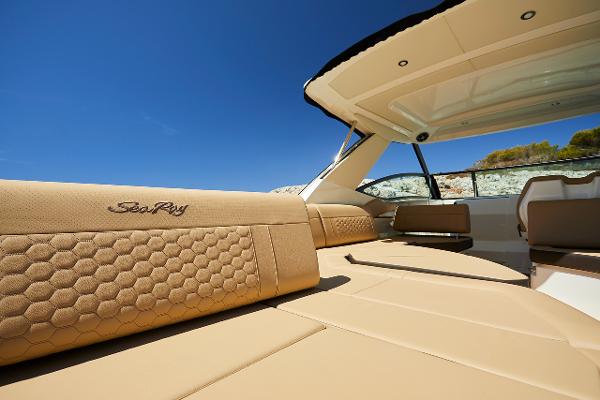 Manufacturer Provided Image: 2023 Sea Ray Sundancer 320 luxury boat interior with tan upholstery and open deck.