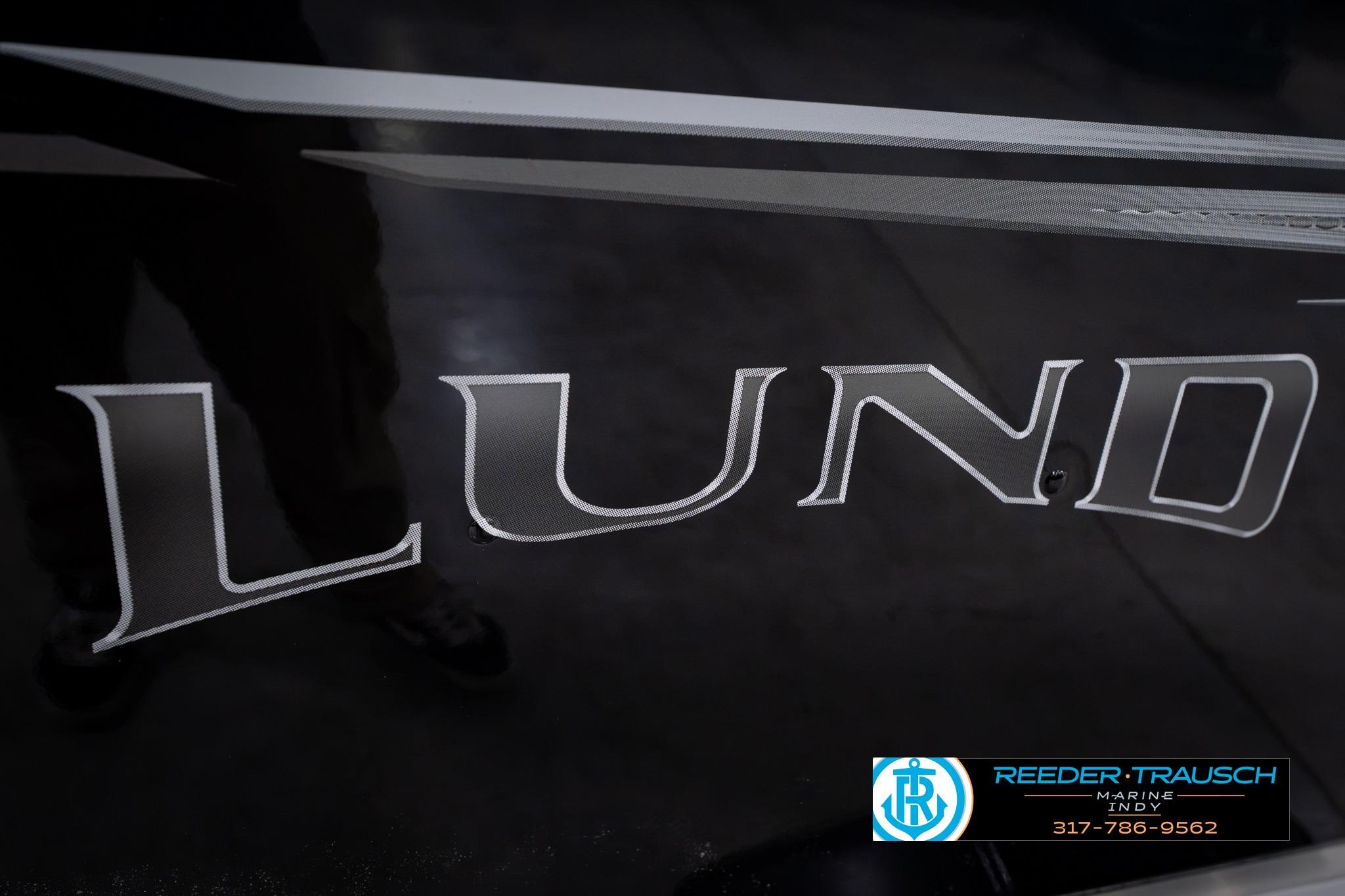 Close-up of 2026 Lund 1600 Fury SS logo on a sleek black surface.