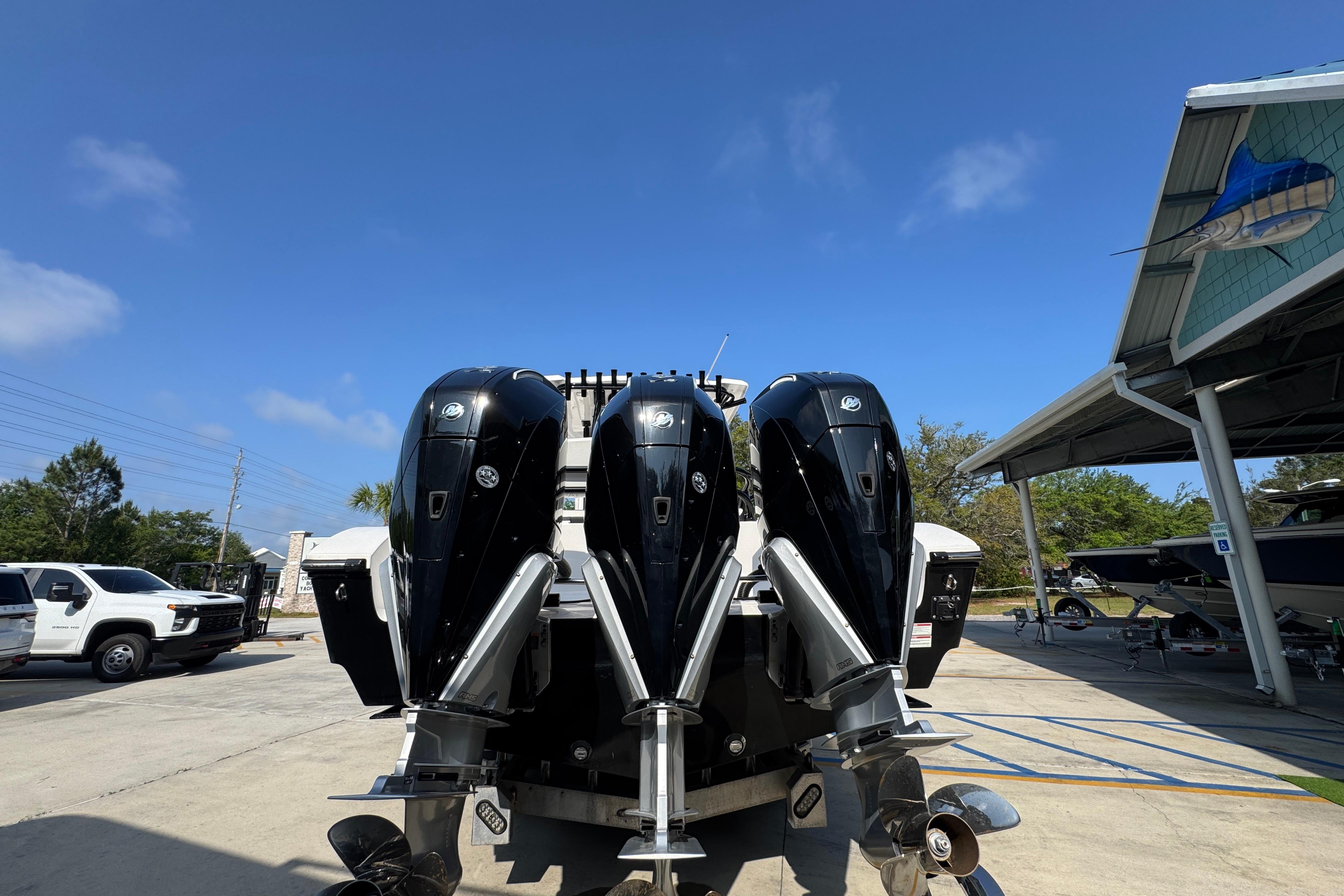 2024 Fountain Bluewater 38 Tournament Edition with triple outboard engines in a marina setting.