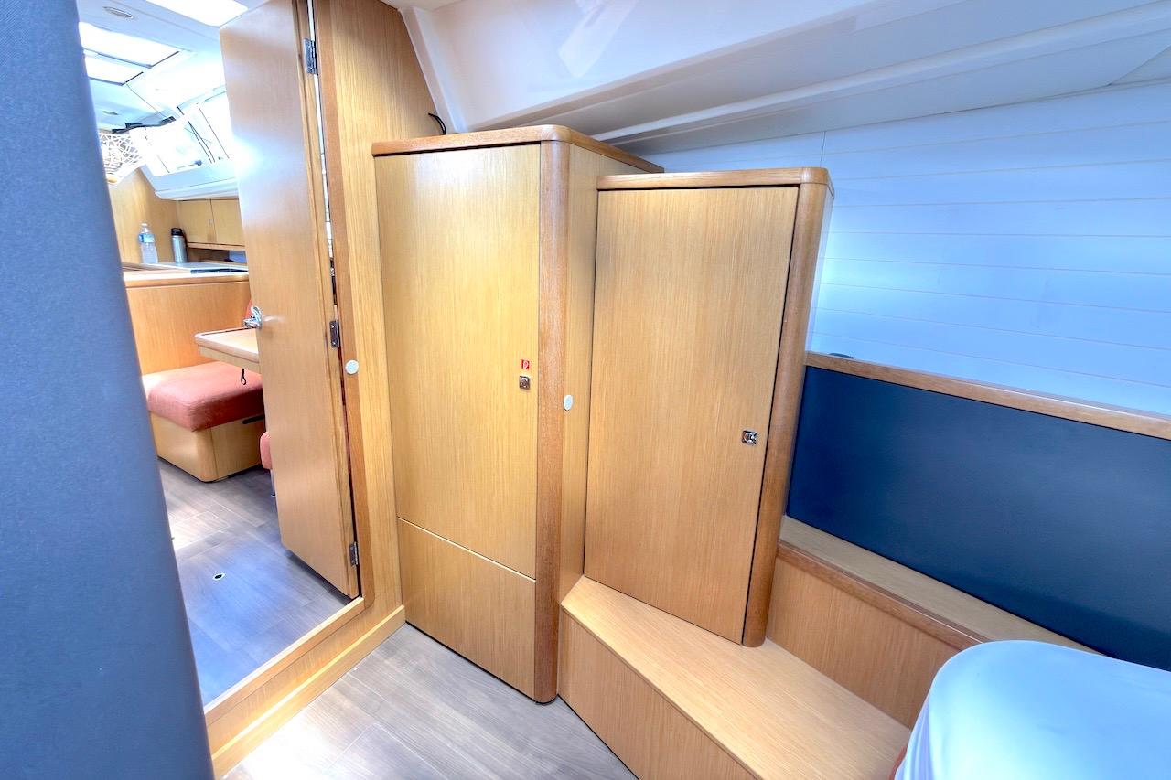 Interior of 2013 Bavaria Vision 46 yacht with wooden cabinetry and seating area.