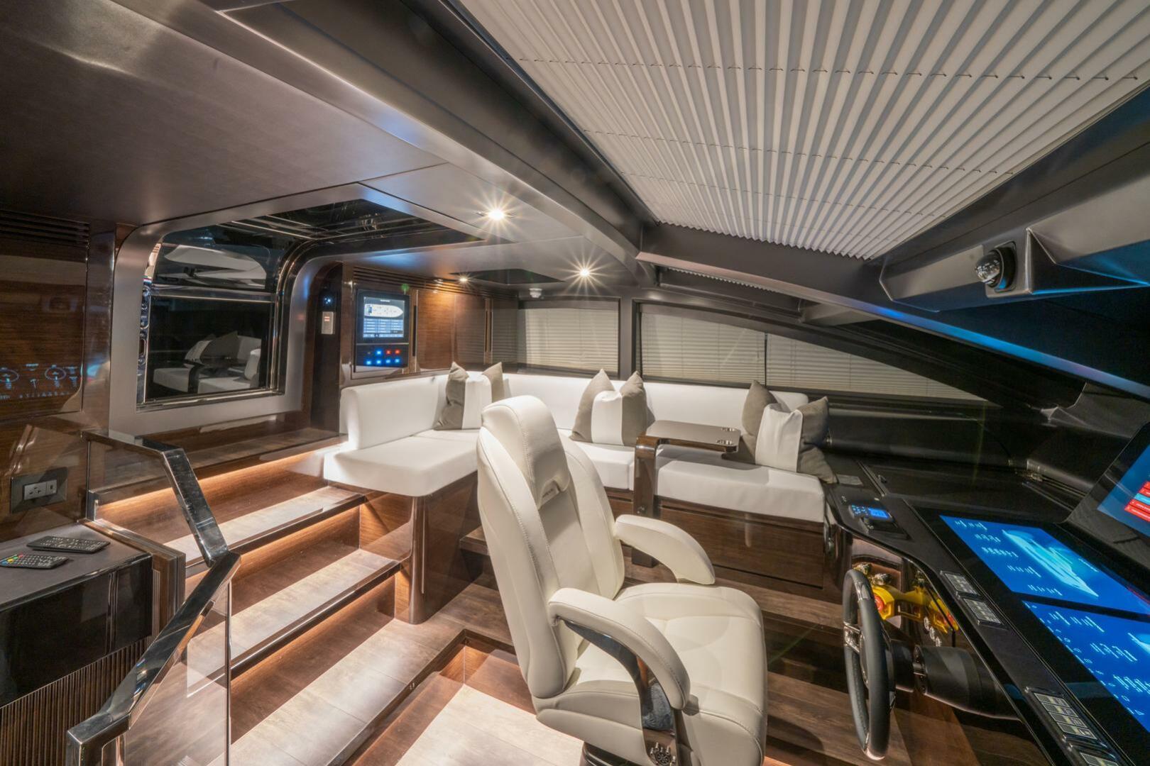Luxurious interior of 2020 Pearl 95 yacht with modern seating and advanced control panels.