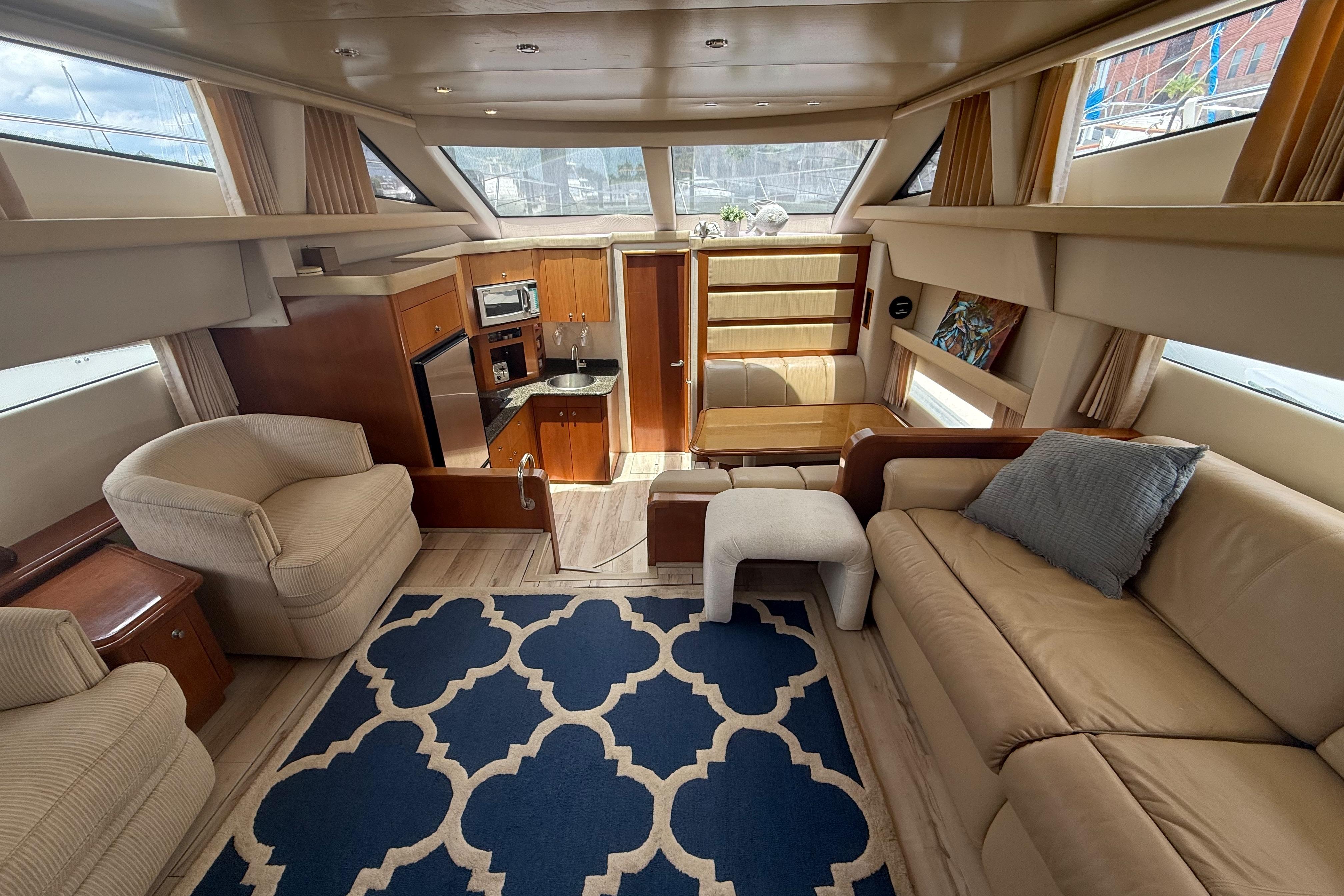 Luxurious interior of 2006 Carver 43 Motor Yacht with plush seating and modern amenities.