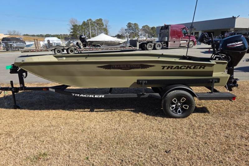 2026 Tracker Grizzly 1650 T Prairie Wings Edition boat on trailer, side view.