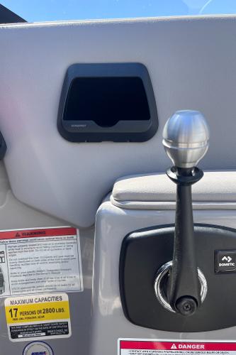 2024 Moomba Max boat dashboard with control lever and warning labels.