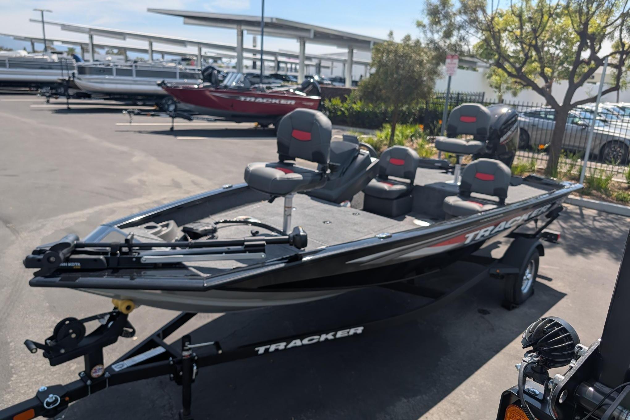 Tracker Pro Team 175 Crappie Edition 2026 on a trailer in a parking lot.