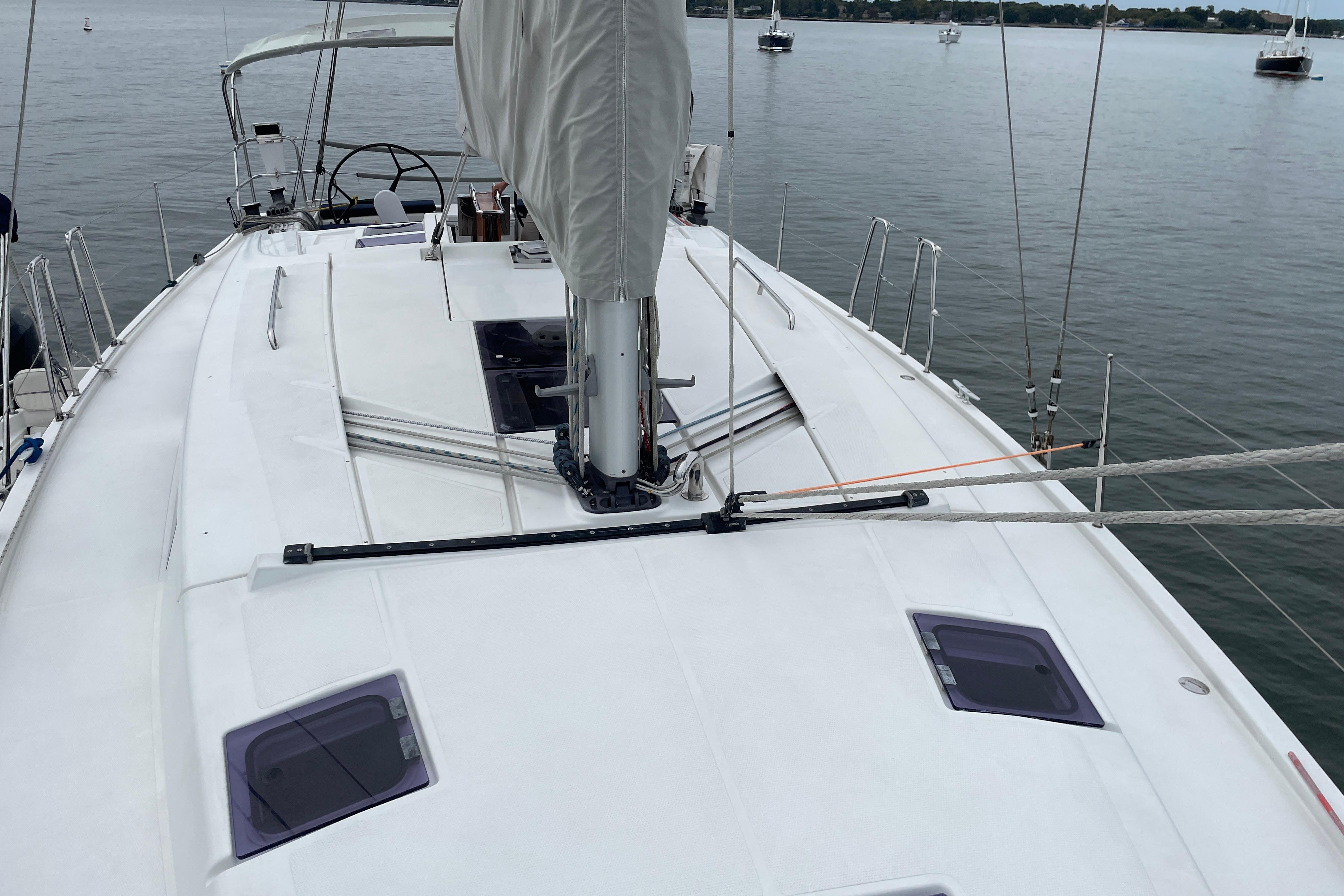 Sailing yacht Hanse 415, 2014 model, docked on calm waters.