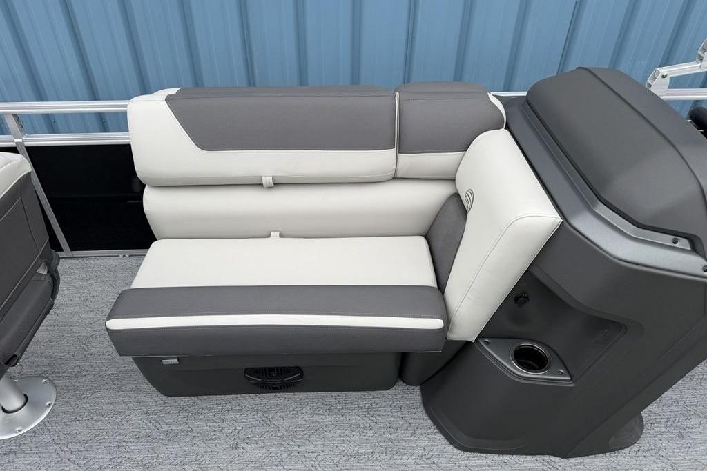 2026 Sun Tracker Fishin' Barge 20 DLX interior seating with gray and white upholstery.