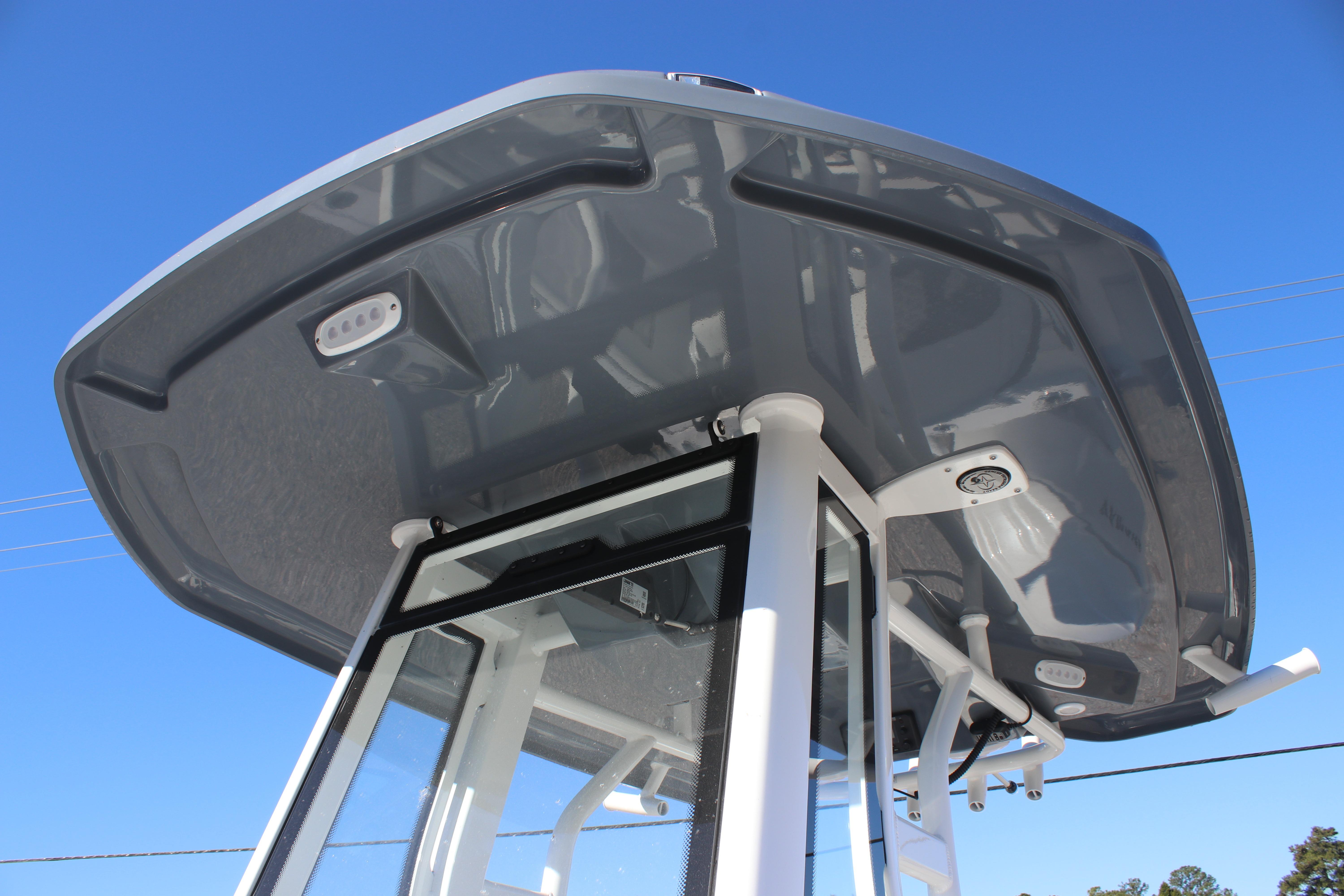 Tidewater 232 CC Adventure 2026 boat's T-top against clear blue sky.