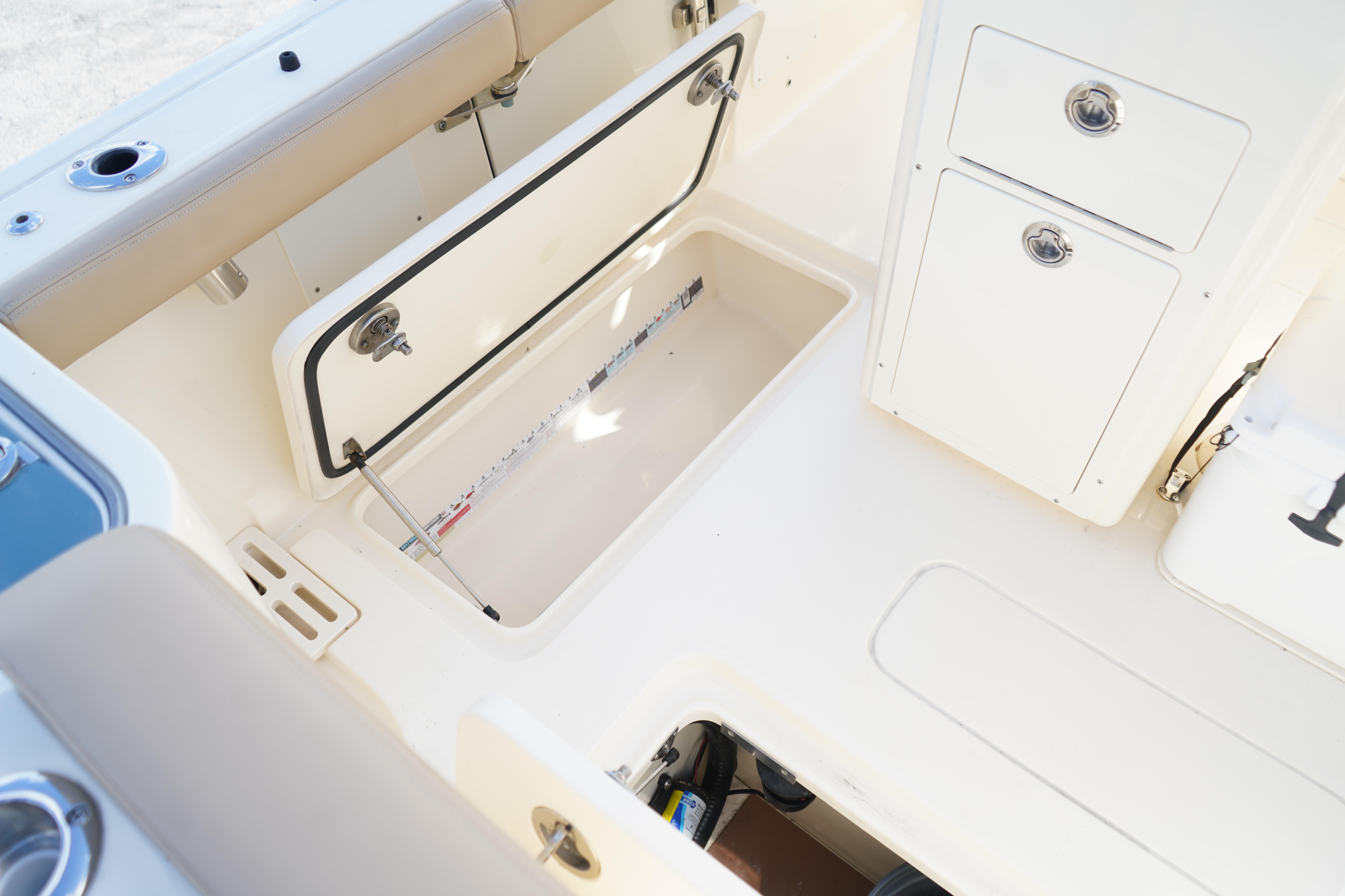 2025 Scout 260 LXF boat interior storage compartments and seating area.