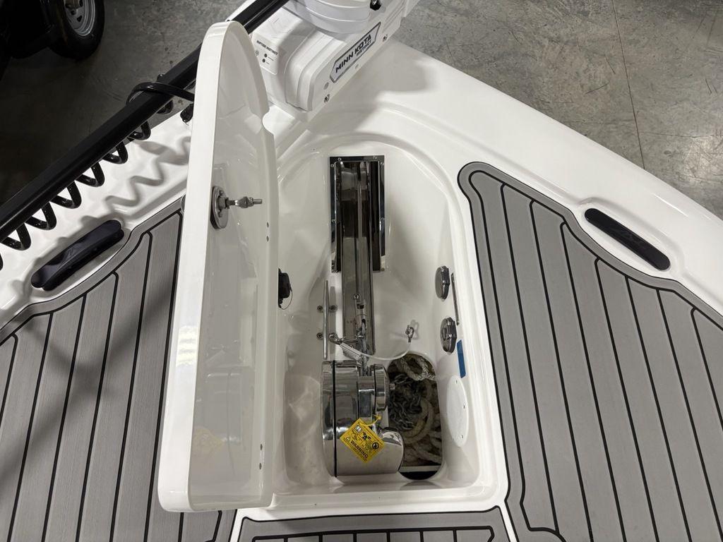 2026 Tidewater 2700 CB boat anchor compartment with open hatch and visible winch system.