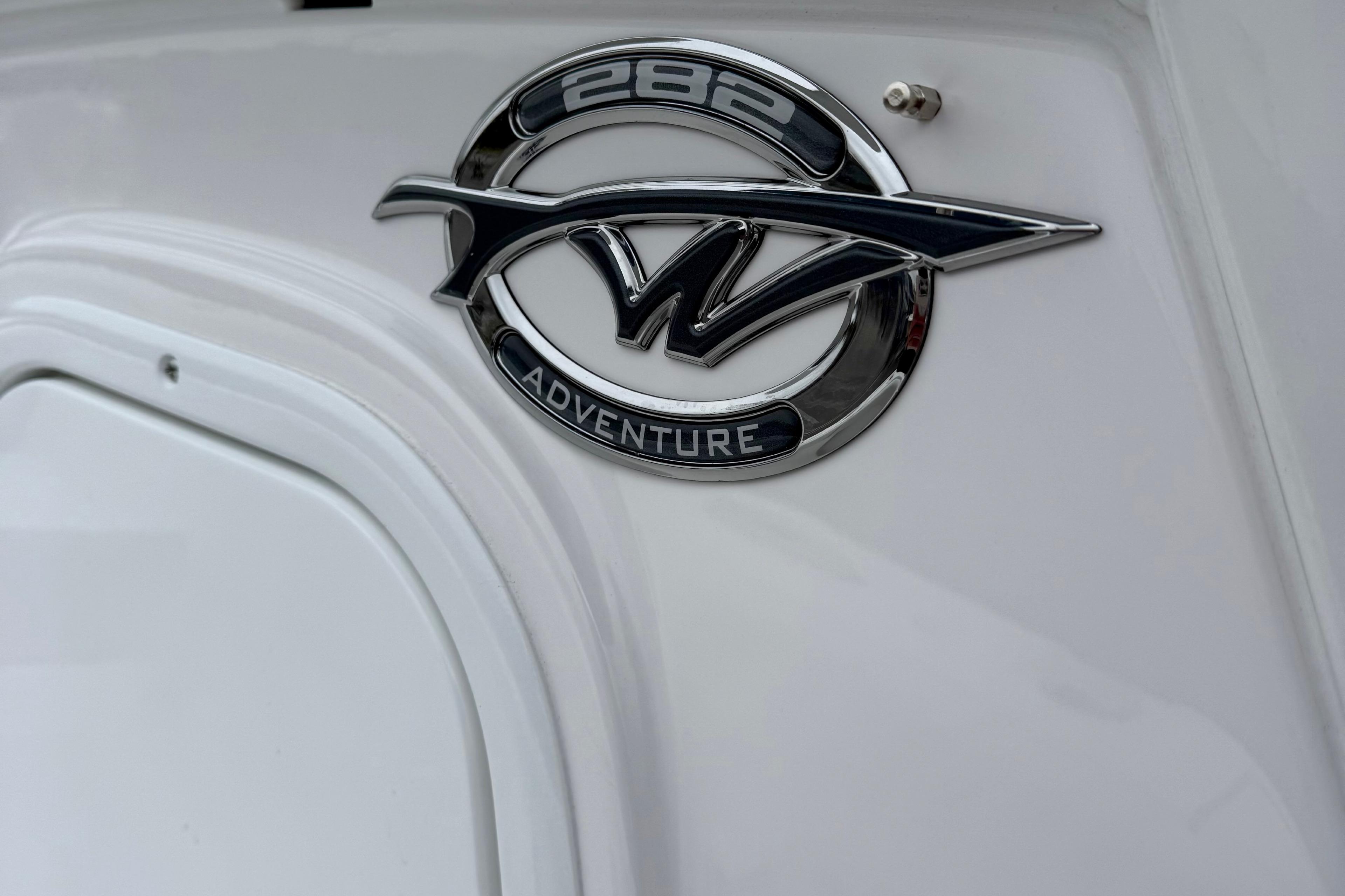 2026 Tidewater 282 CC Adventure boat emblem on white surface.