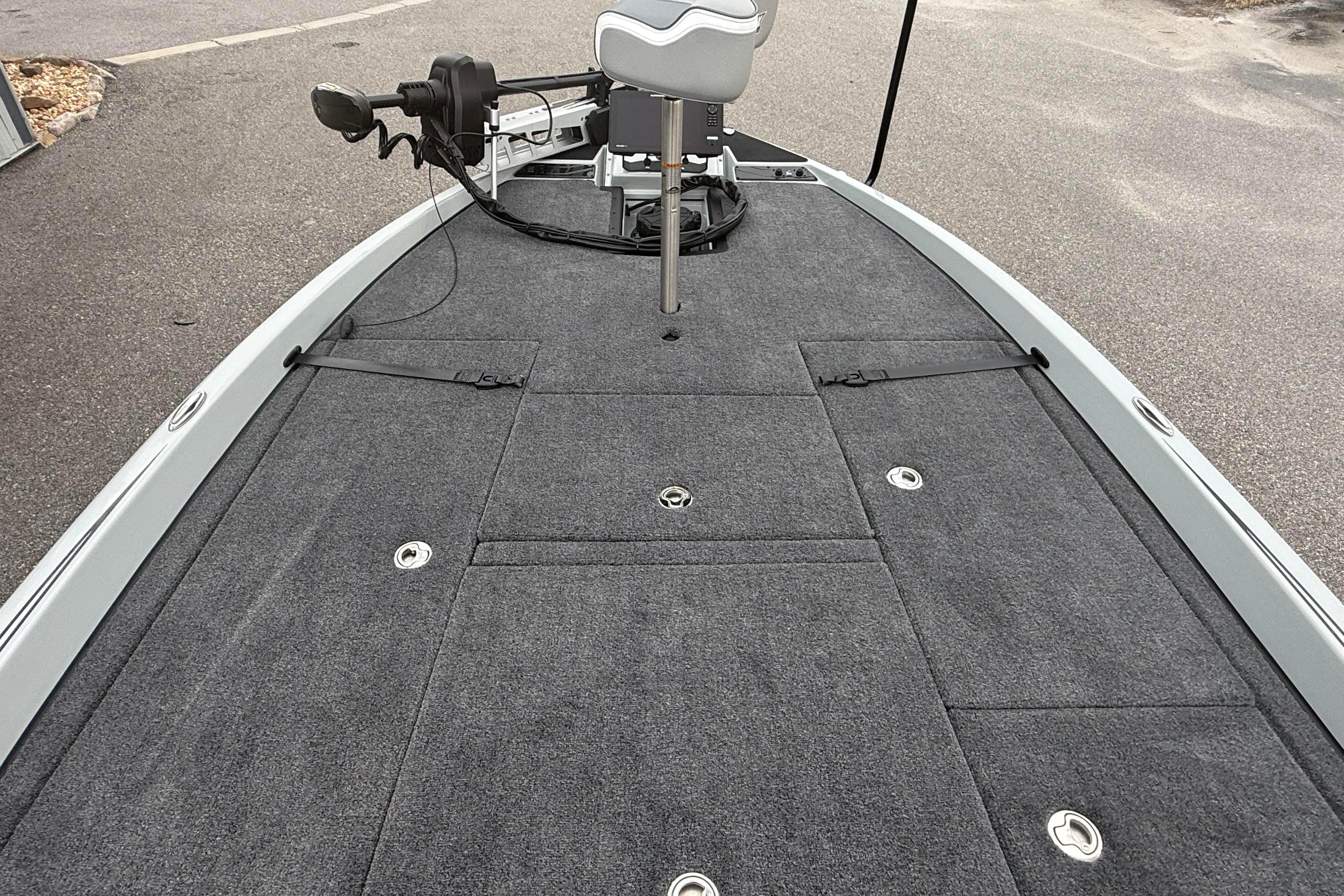 Front deck of 2027 Phoenix 921 Elite X II fishing boat with carpeted surface.