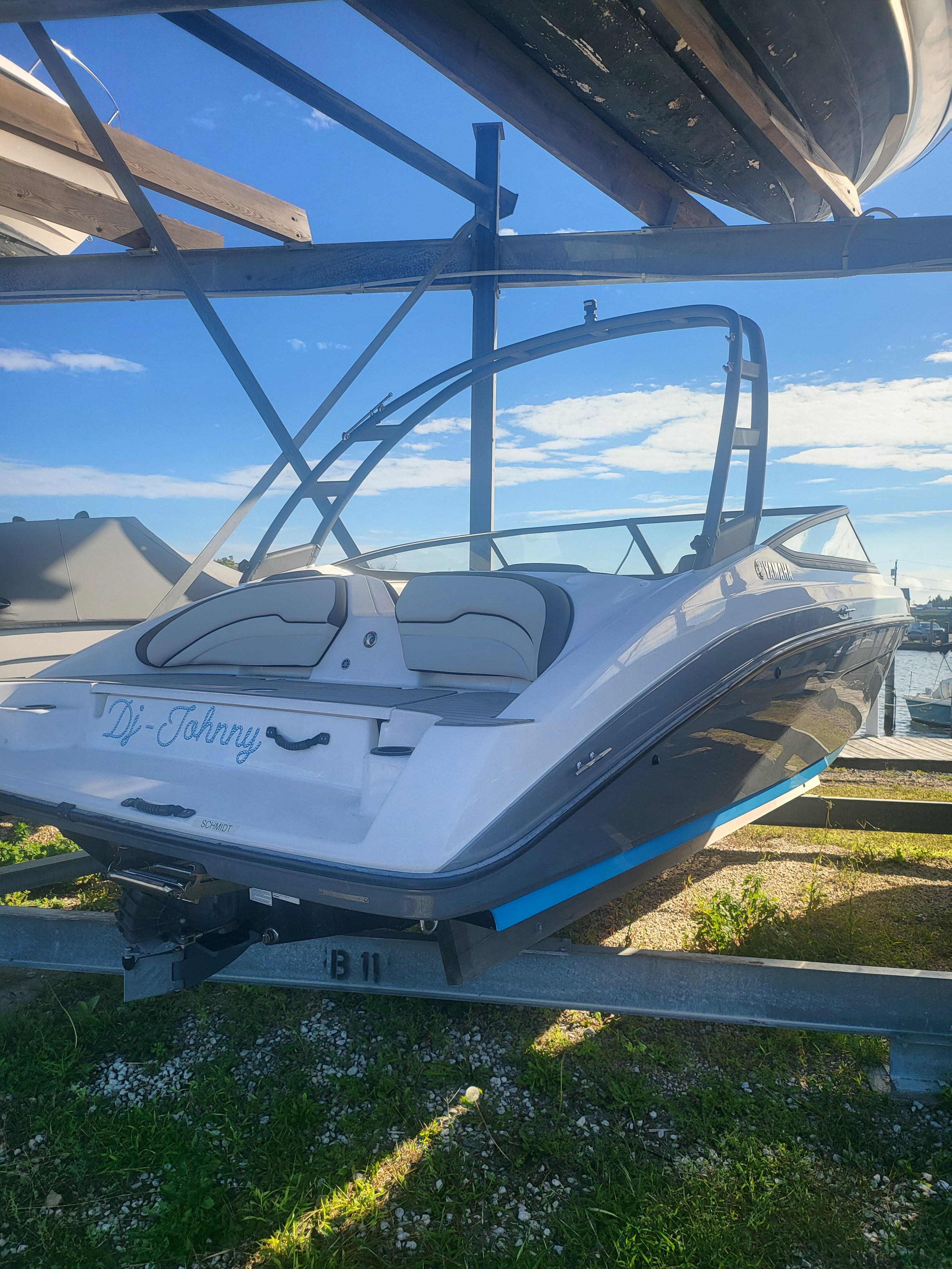 2019 Yamaha Boats AR190 on a trailer, sunny day, marina background.