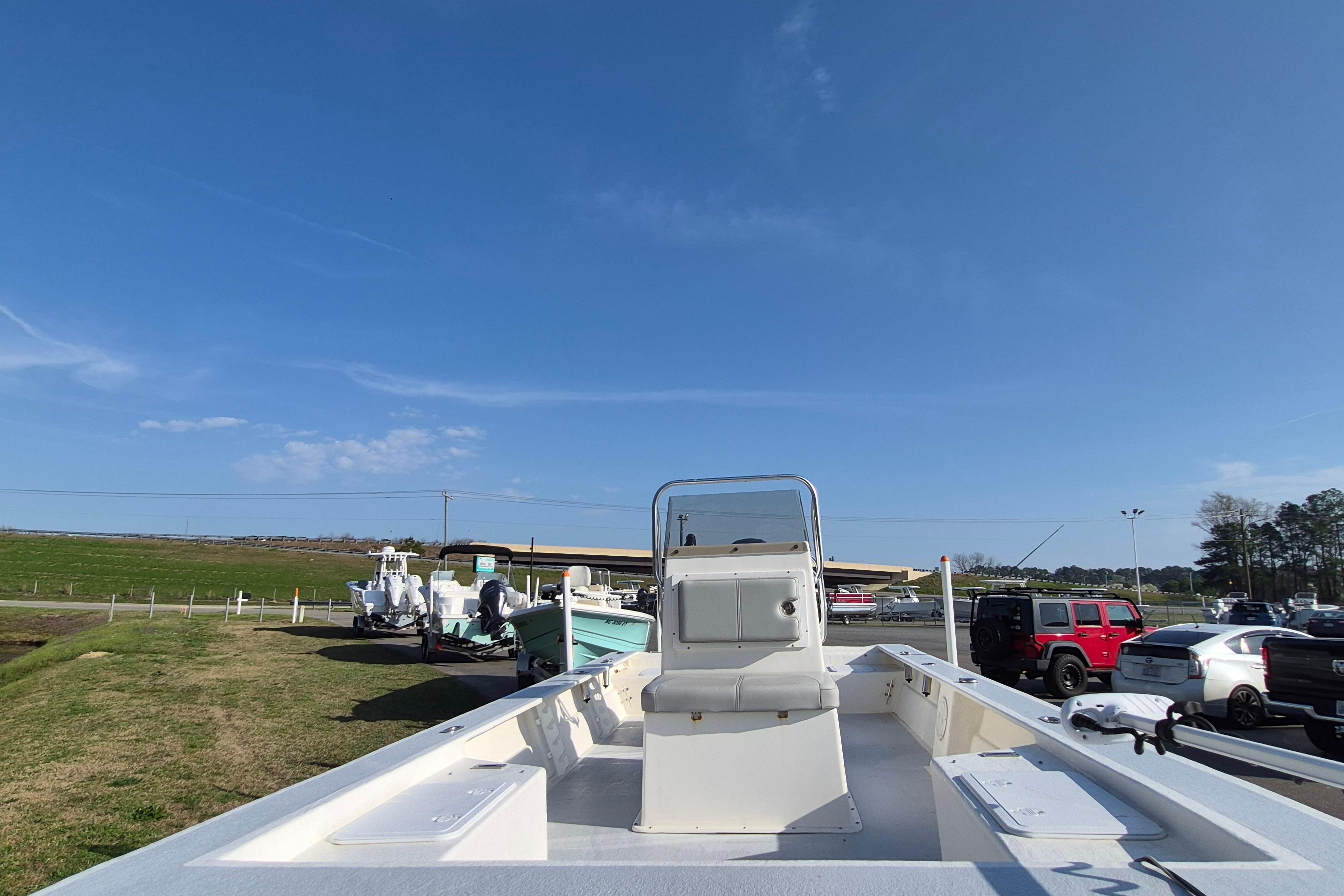 2024 May-Craft 22 Hancock Skiff boat on display under clear blue sky.