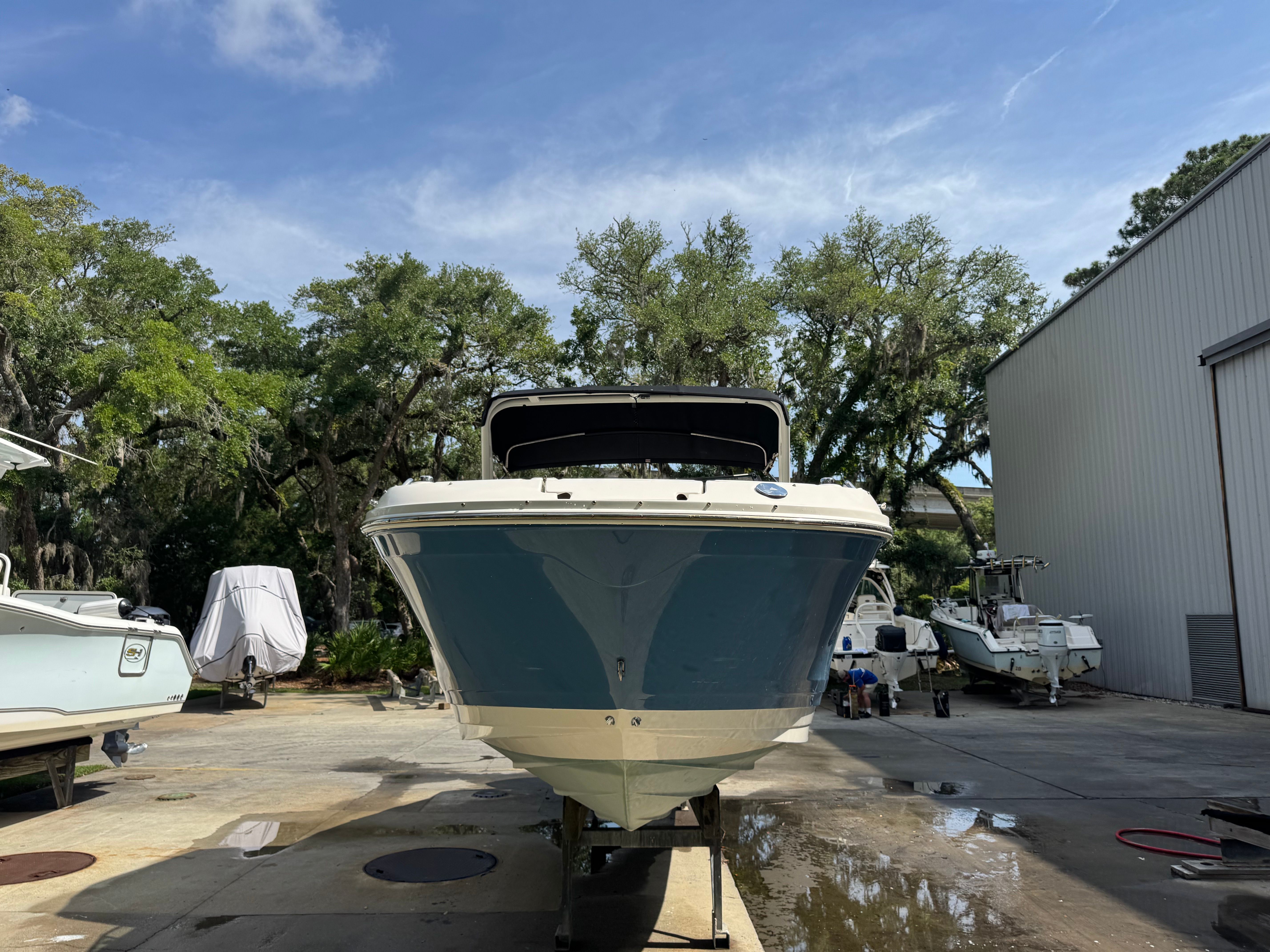 2020 Sea Ray SDX 270 Outboard on a boatyard.