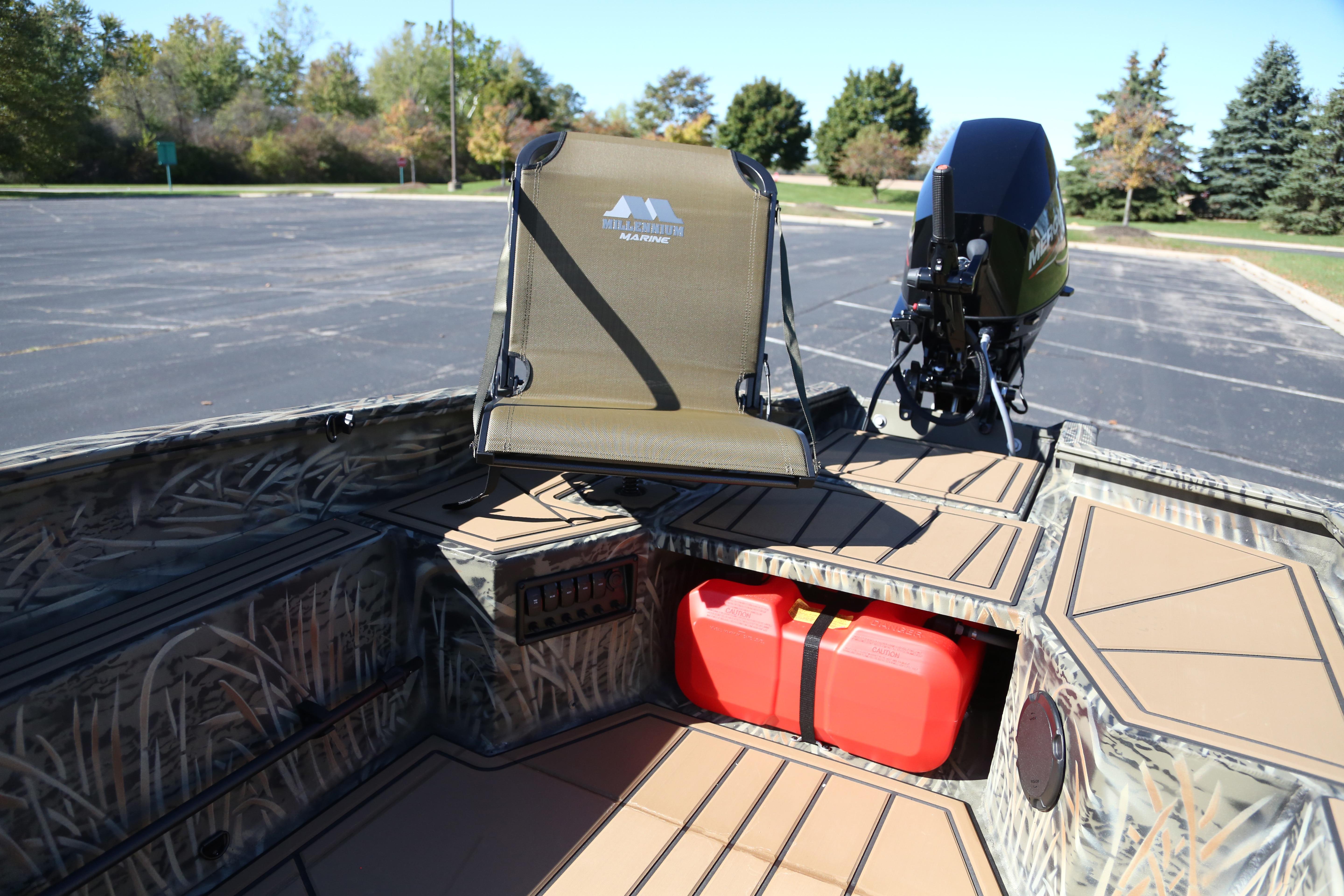 2026 Tracker Grizzly 1650 T Prairie Wings Edition boat interior with camo design and motor.