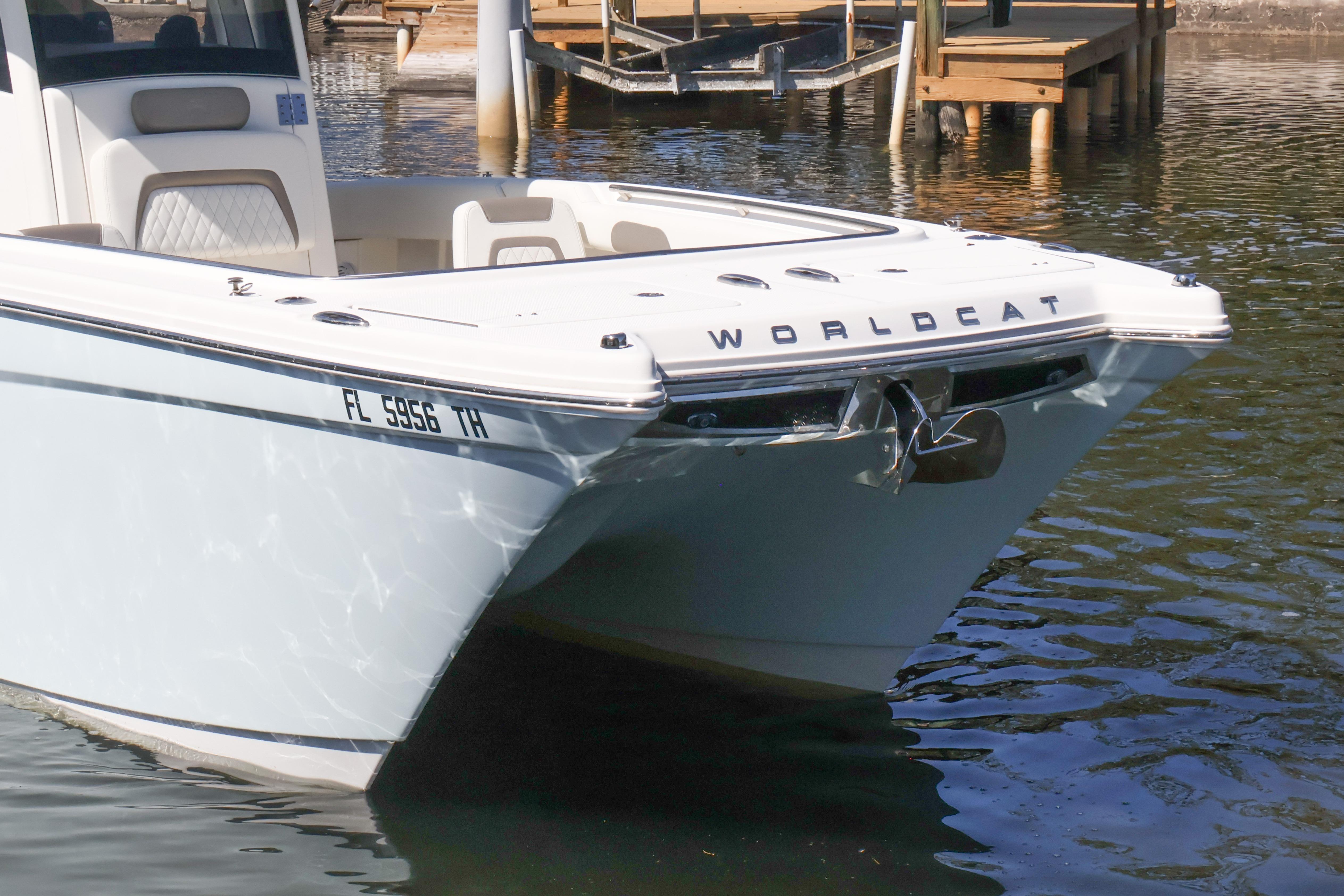 2022 World Cat 280 CC-X boat docked on calm water.