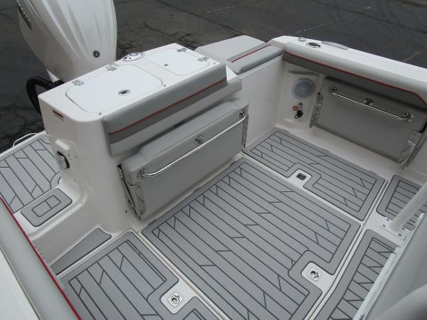 2025 Solara S-250 CW boat deck with gray non-slip flooring and storage compartments.
