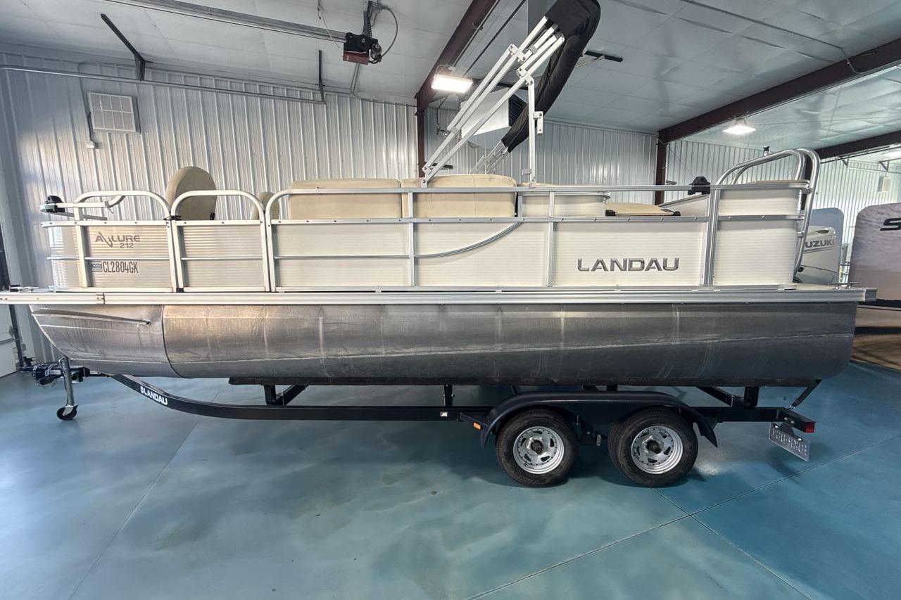 2018 Landau Alure 212 Fish pontoon boat on trailer in indoor storage.