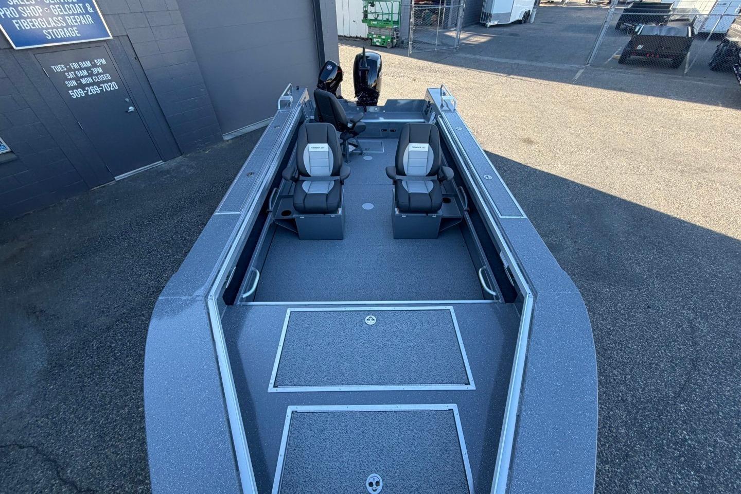 2026 Thunder Jet 209 Rush OT boat with dual seats, parked outdoors.