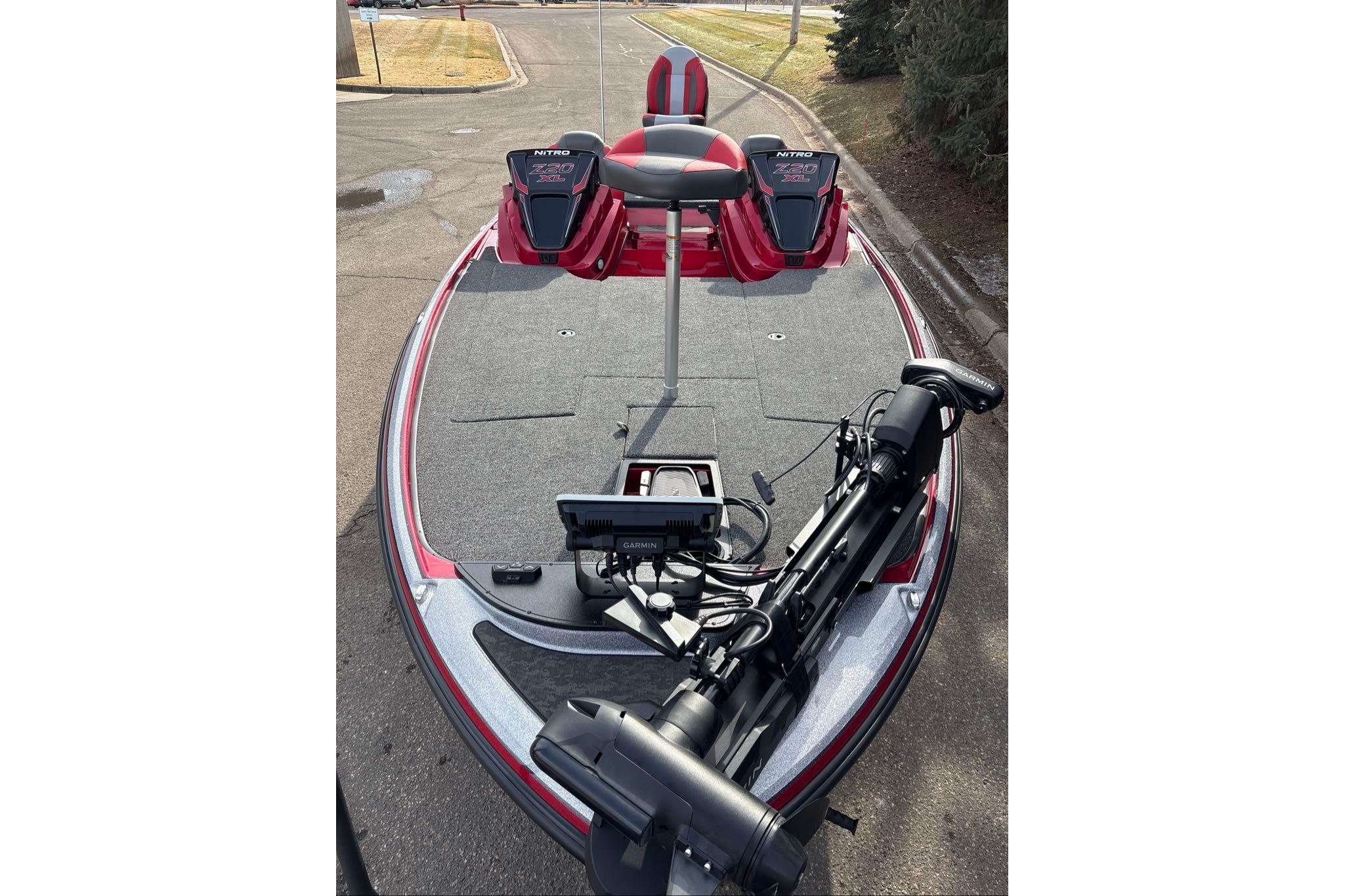 2026 Nitro Z20 XL Pro fishing boat with advanced equipment on a paved road.