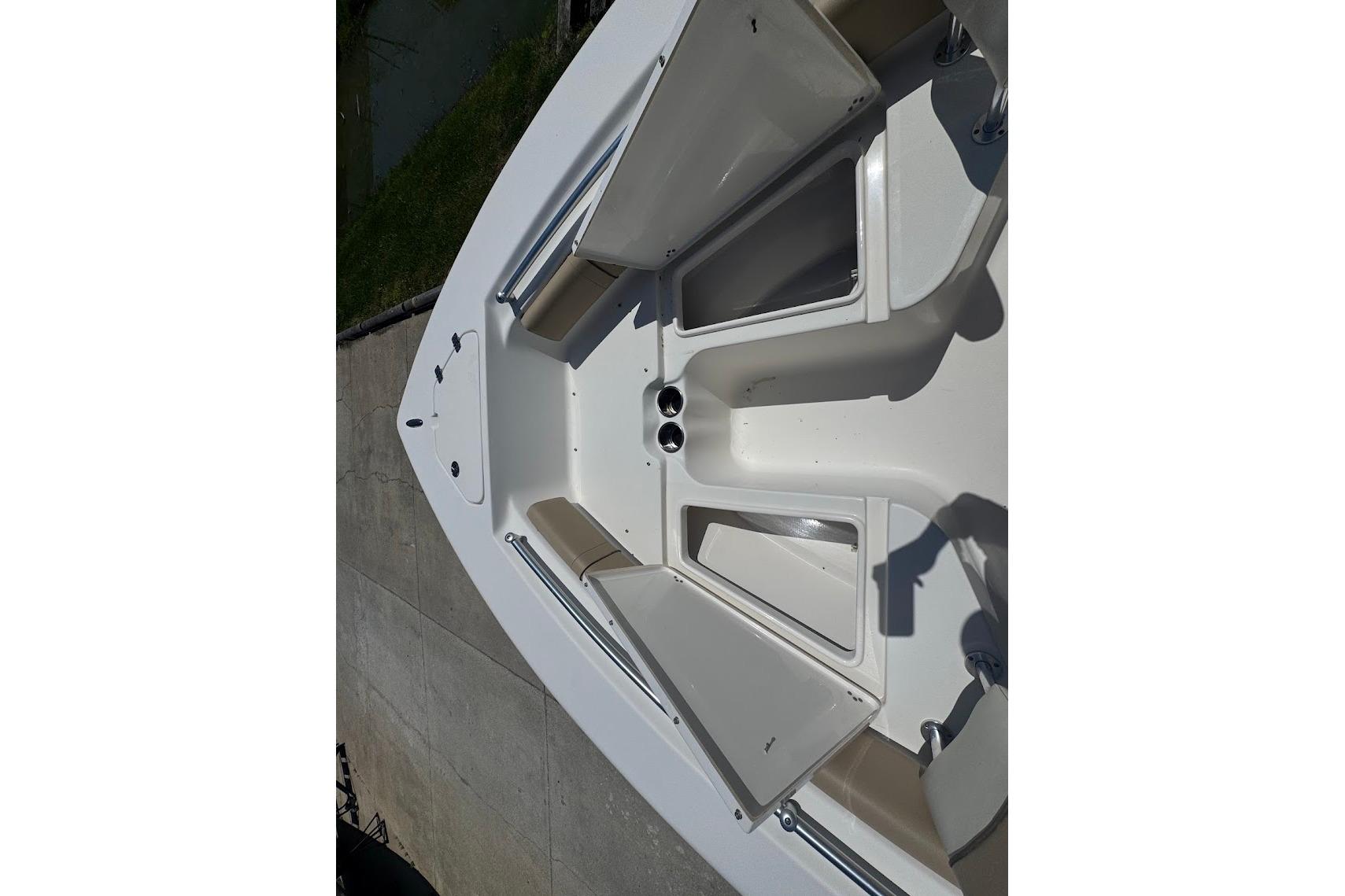 2015 Key West 219 FS boat interior with seating and storage compartments.