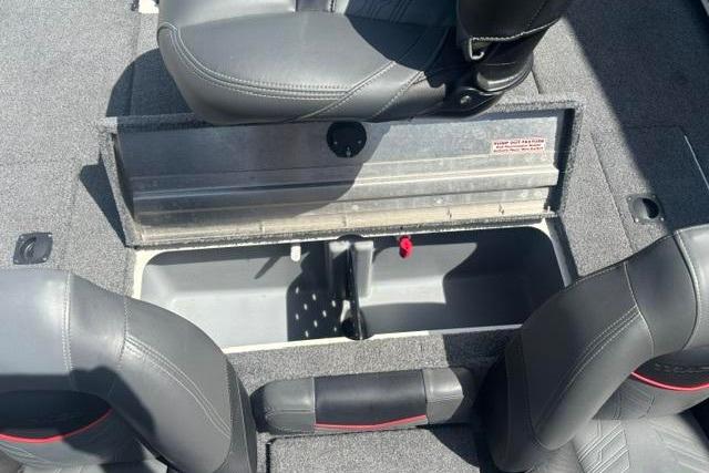 2021 Tracker Pro Team 175 TXW Tournament Edition boat interior with storage compartment open.
