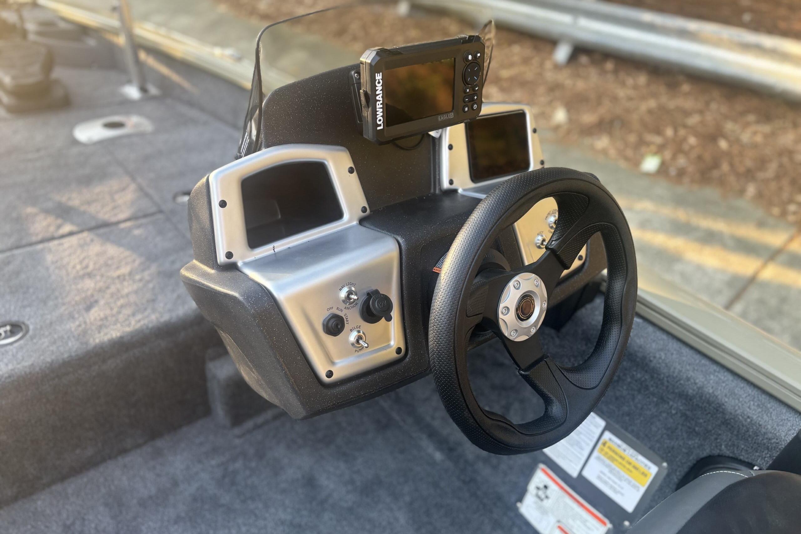 Steering console of 2026 Tracker Pro Team 175 Crappie Edition boat with navigation equipment.