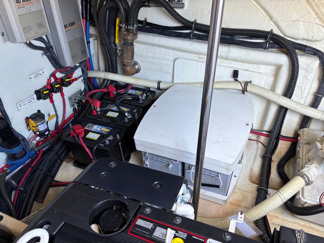 The engine room of a 2011 Formula 45 with batteries, cables, and technical components.