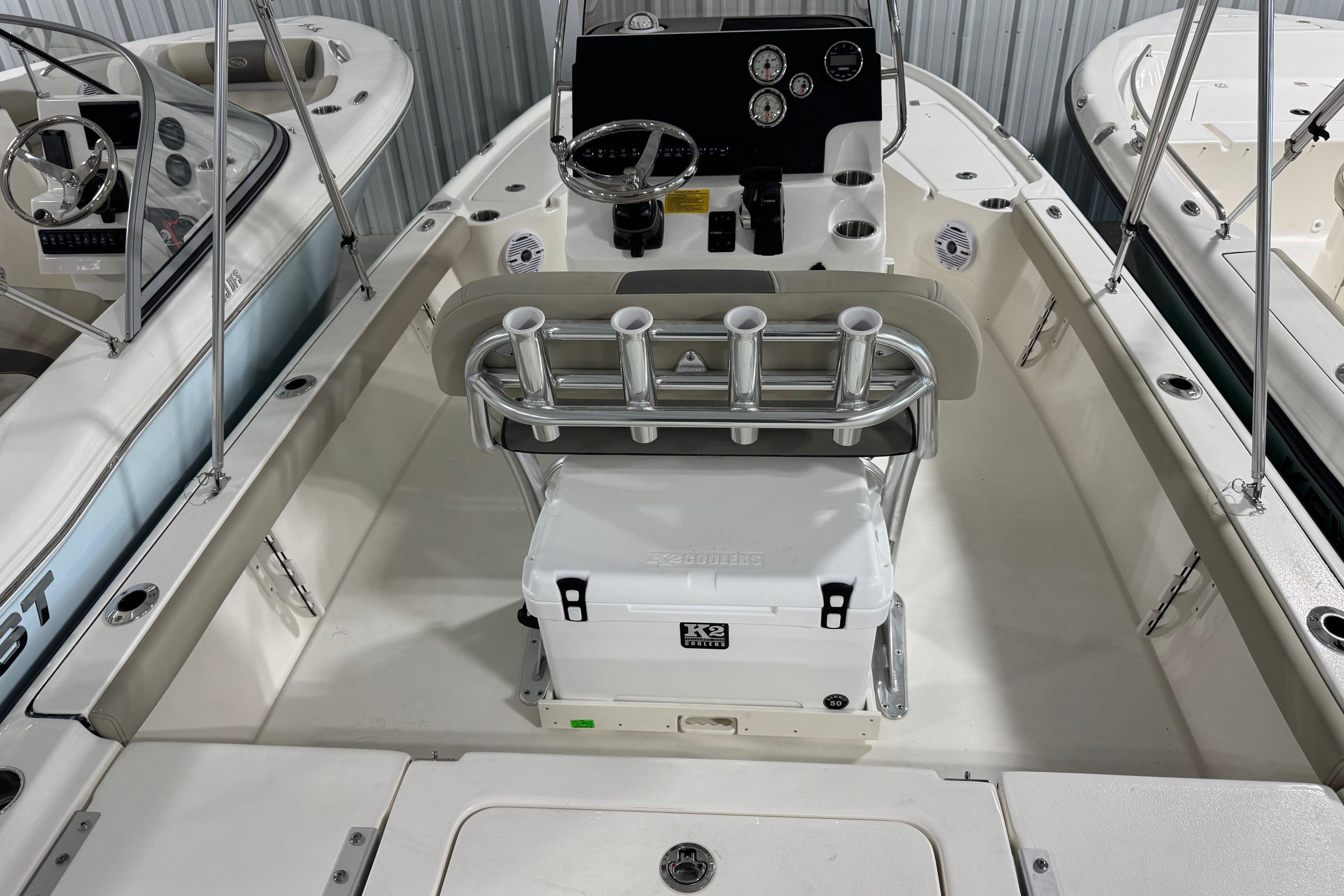 2026 Key West 210 Bay Reef boat interior with steering console and rod holders.