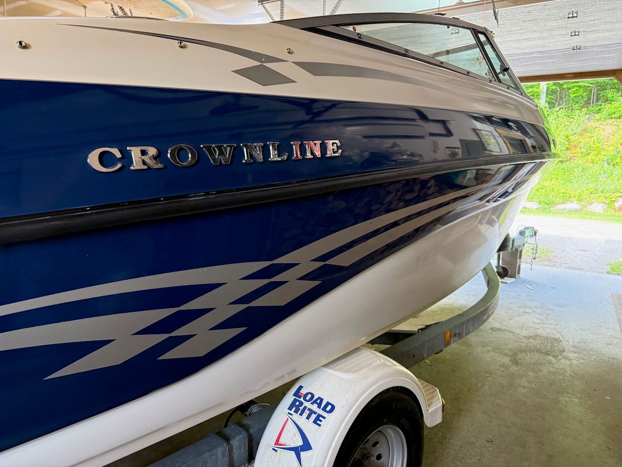 Crownline 192 BR boat from 2000 in a garage.