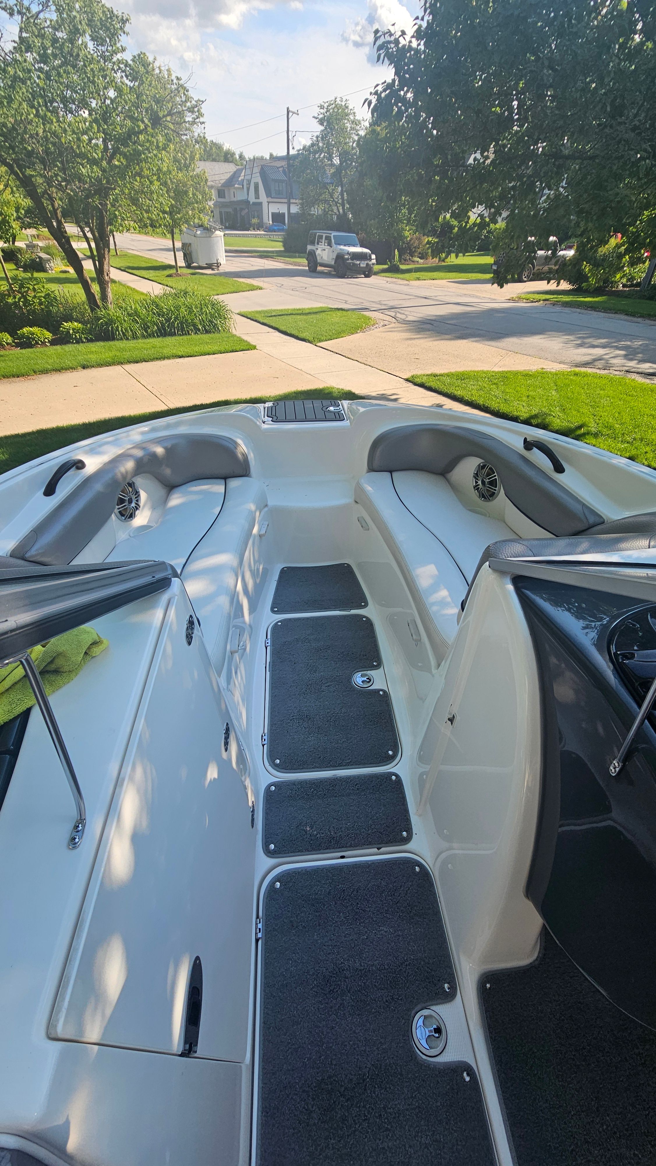 2010 Yamaha AR210 with spacious bow area, cushioned seats, and speakers, parked on a trailer.