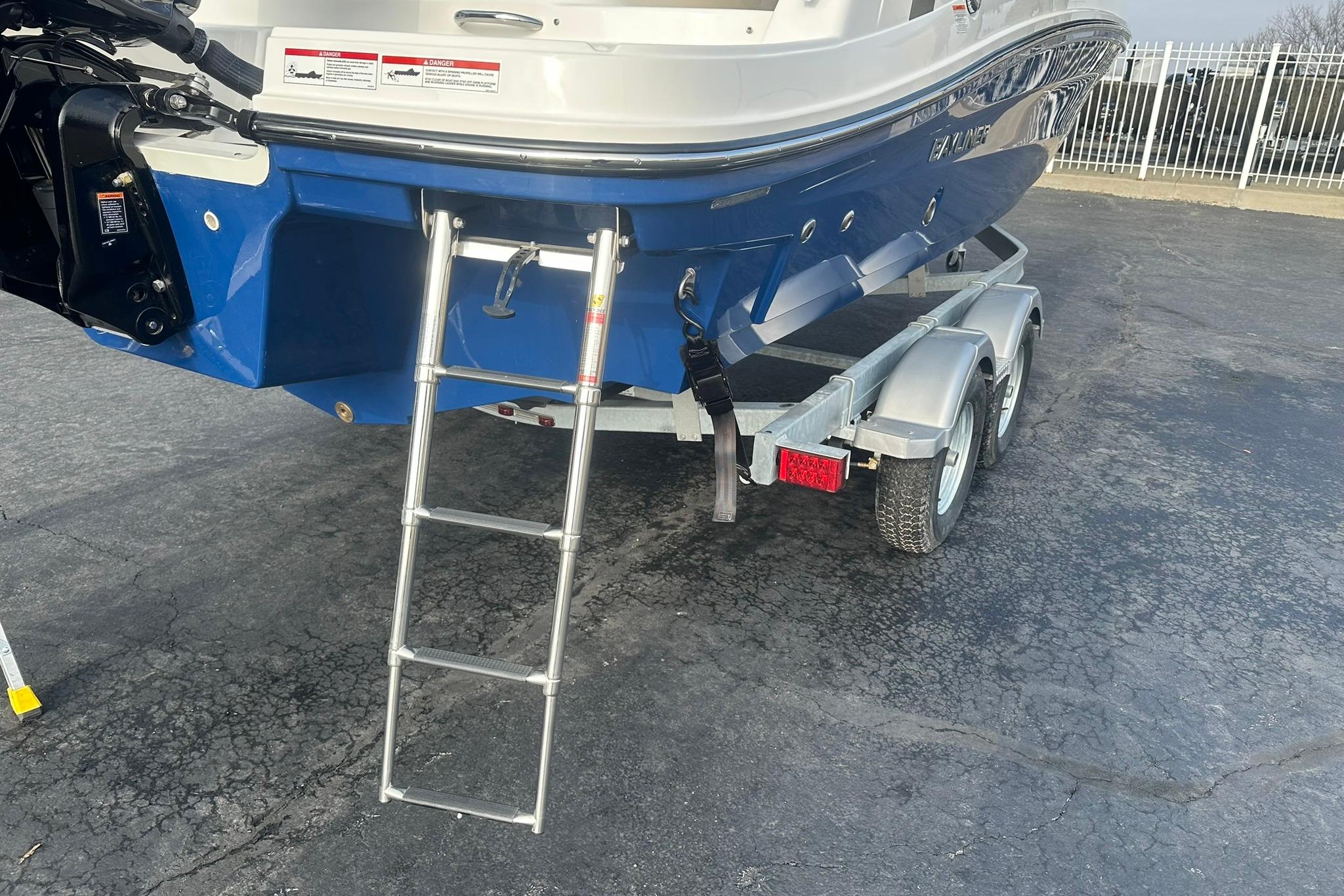 2026 Bayliner VR6 Bowrider OB on trailer with ladder, blue hull.