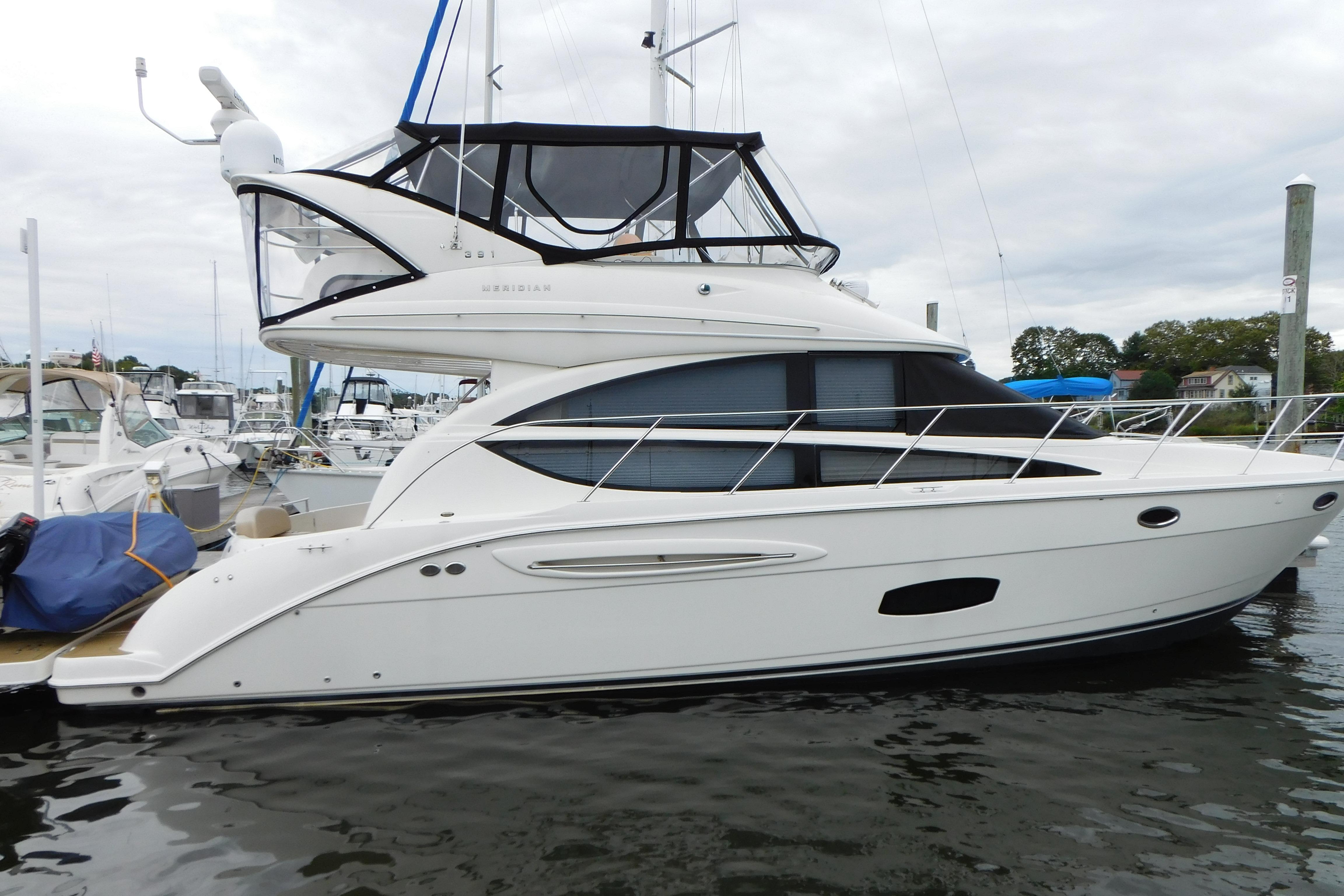 2009 Meridian 391 Sedan yacht docked at marina, side view.