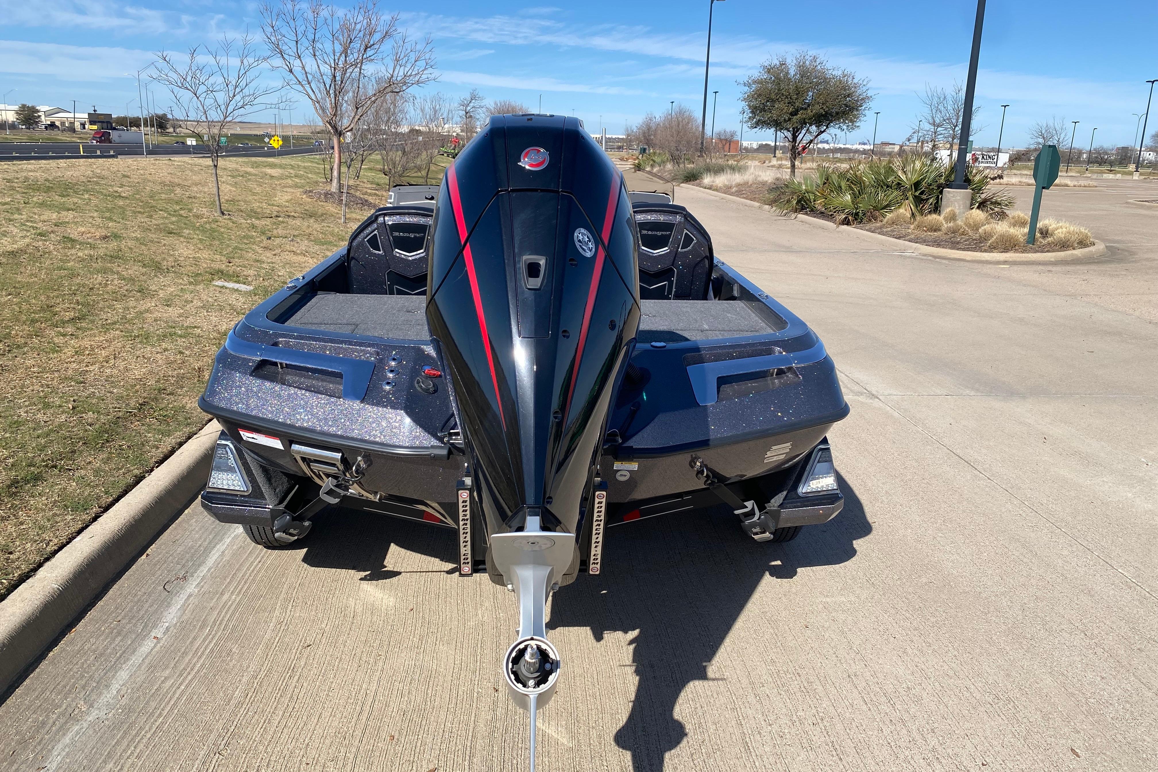 2025 Ranger Z520 boat parked on a sunny day, rear view.