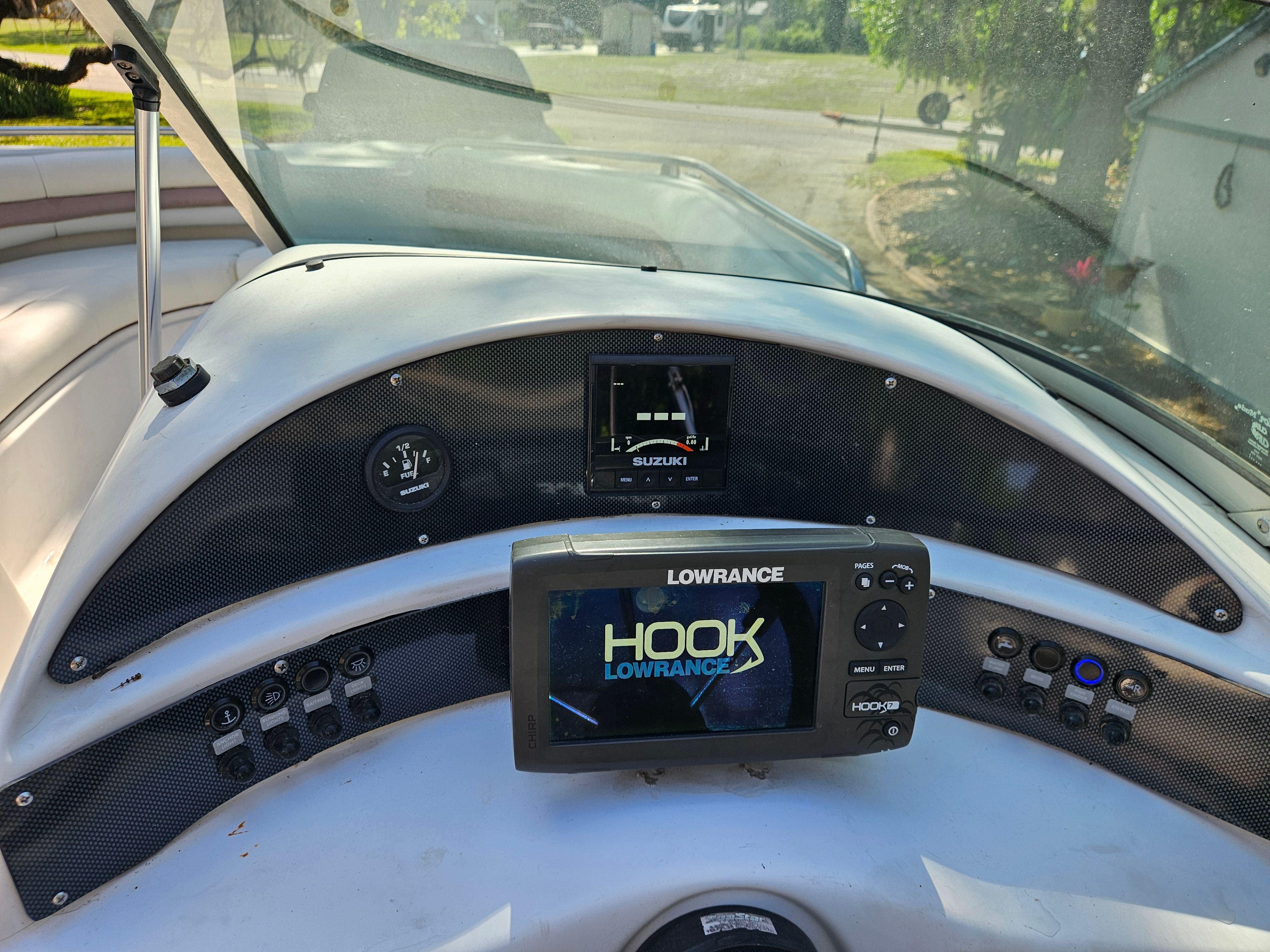 The image shows the dashboard of a 2001 Hurricane 237 boat with a navigation system.