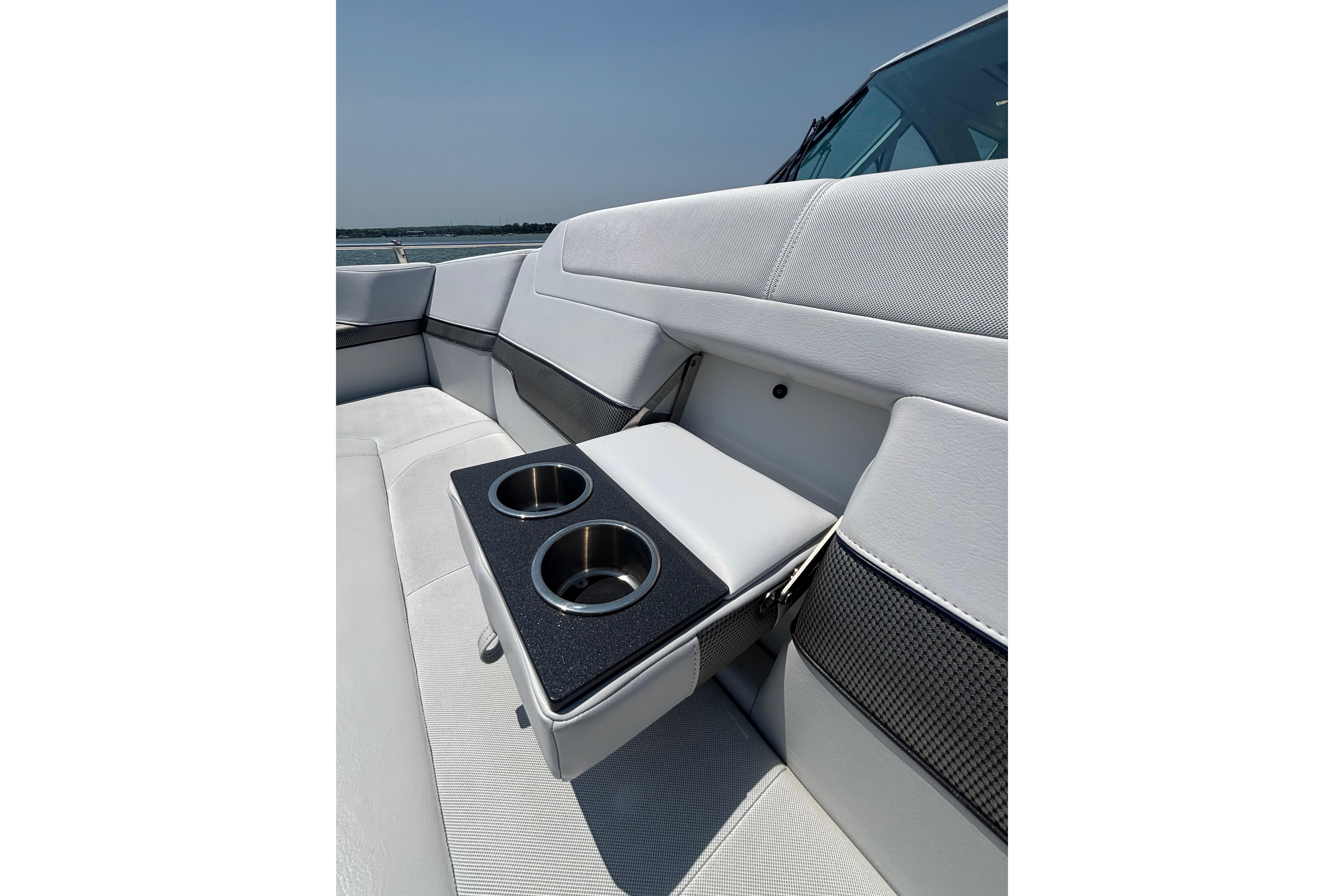Interior of 2019 Formula 430 Super Sport Crossover boat with cup holders and seating.