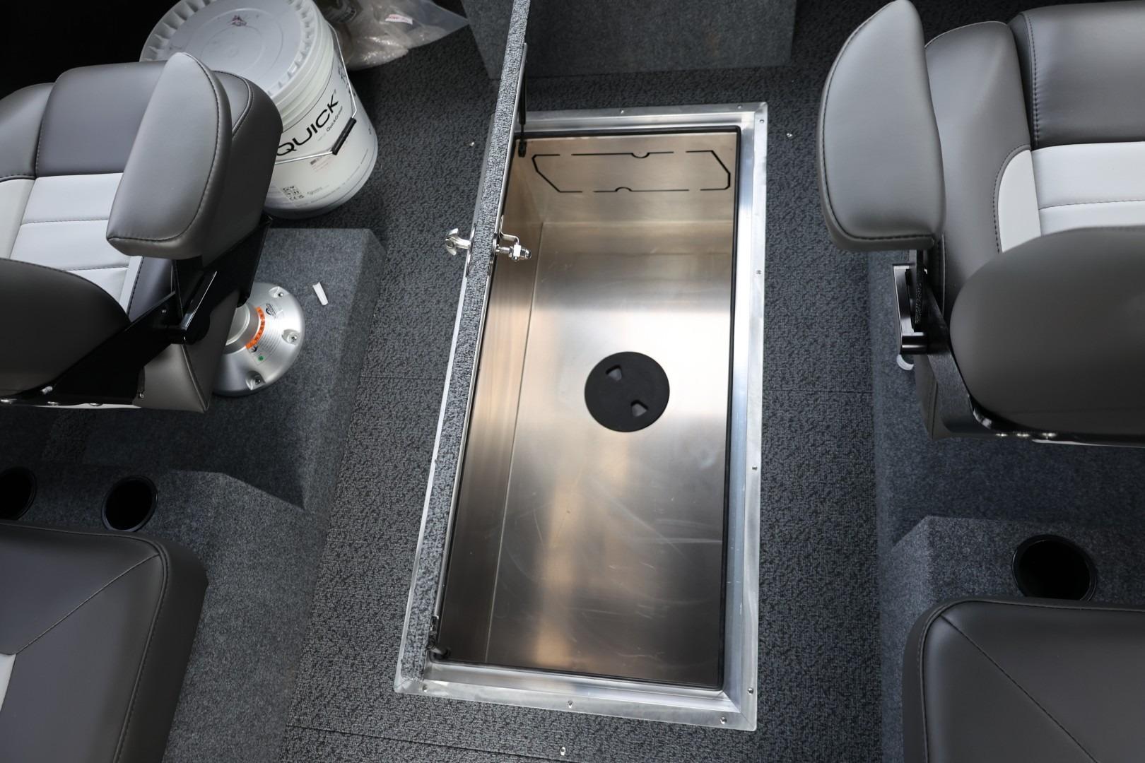 2026 Thunder Jet 24 Alexis Pro interior with open storage compartment and seating.