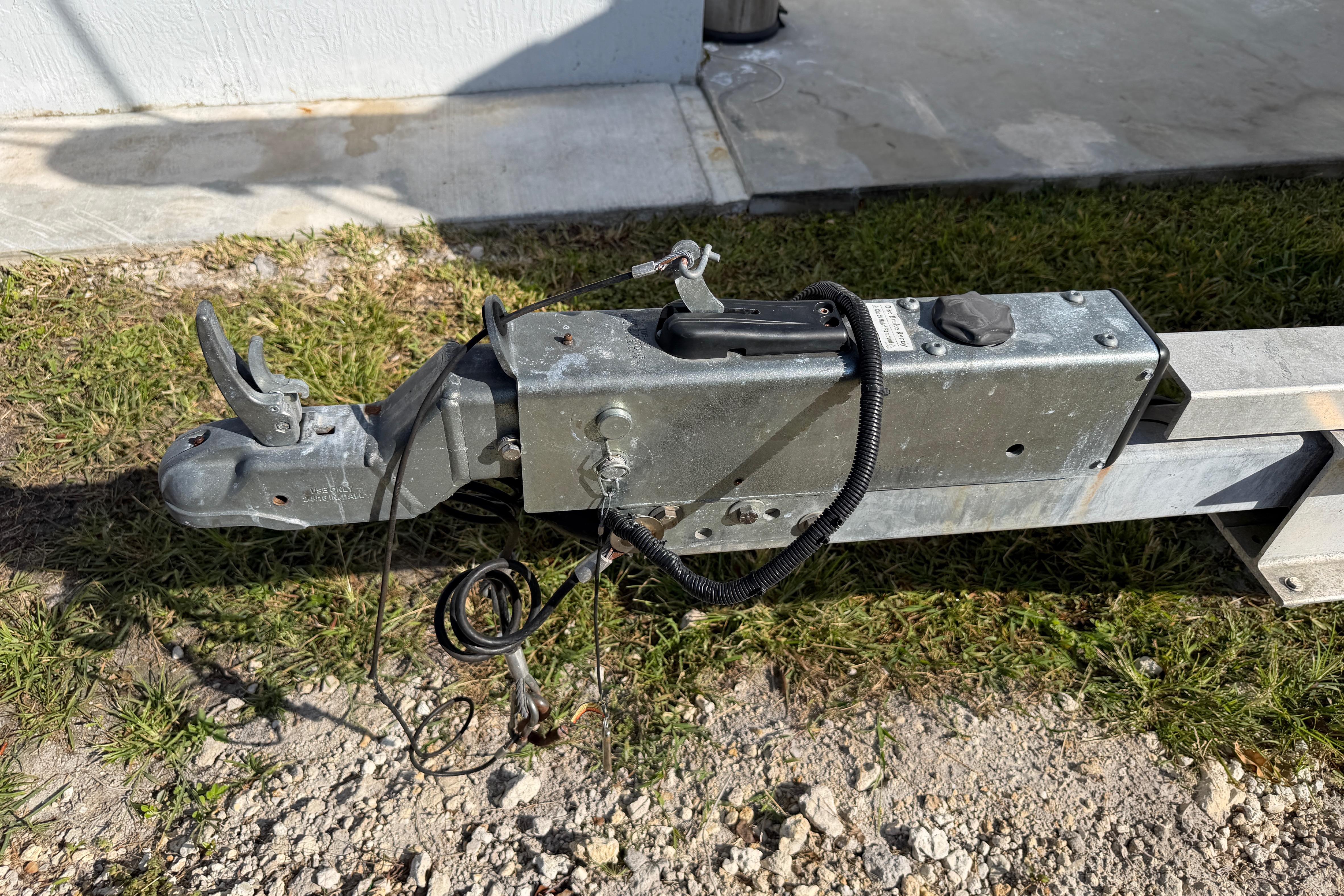 Trailer hitch of a 2006 Grady-White Sailfish 282 boat on grass.