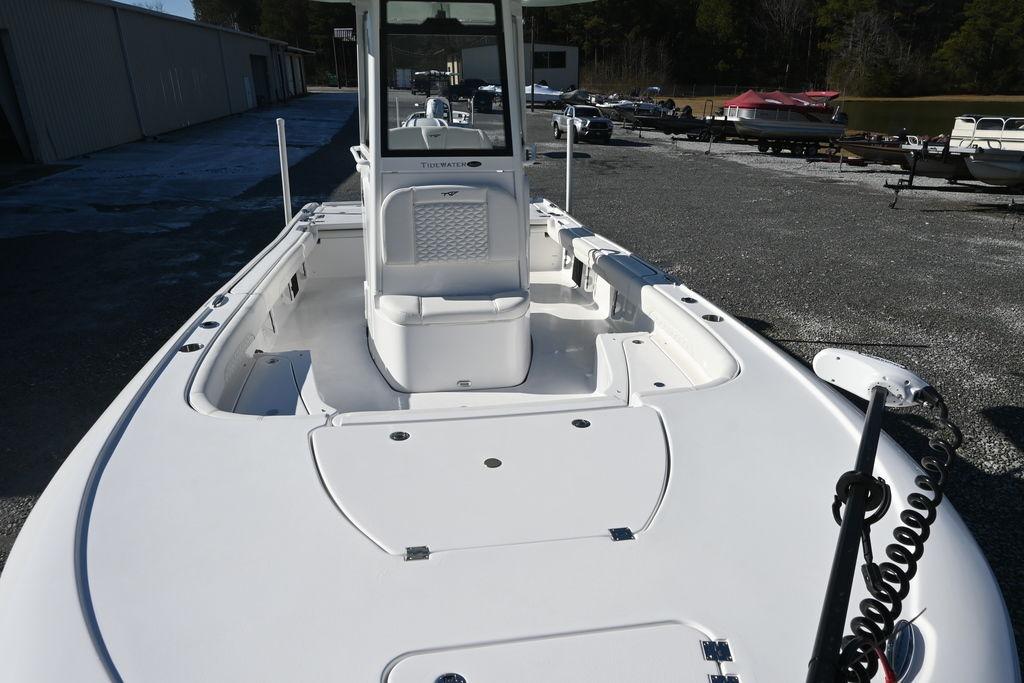 2026 Tidewater 2500 Carolina Bay boat, sleek white deck, parked outdoors.