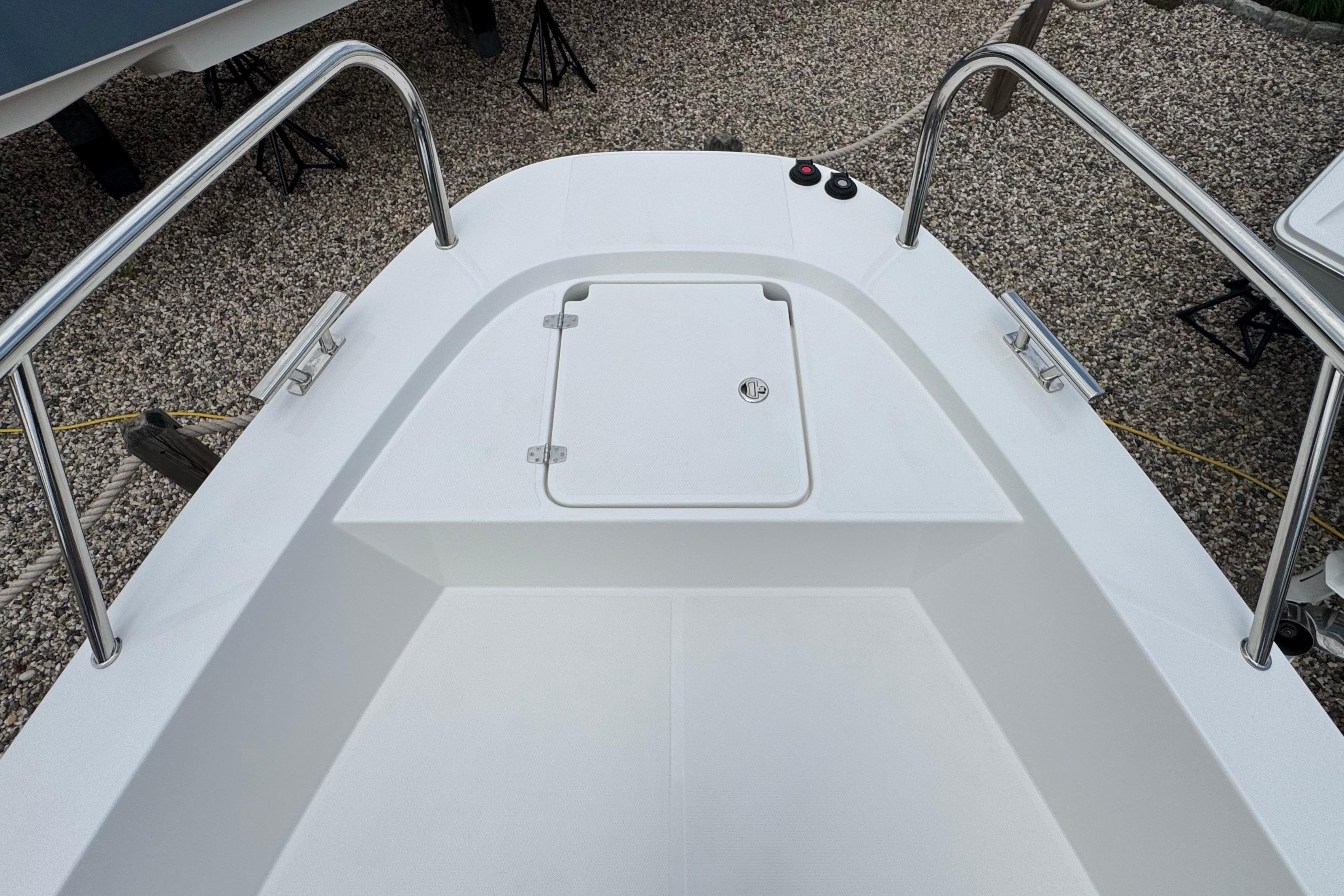 The image shows the foredeck of a Nimbus Commuter 9 boat with an access hatch.