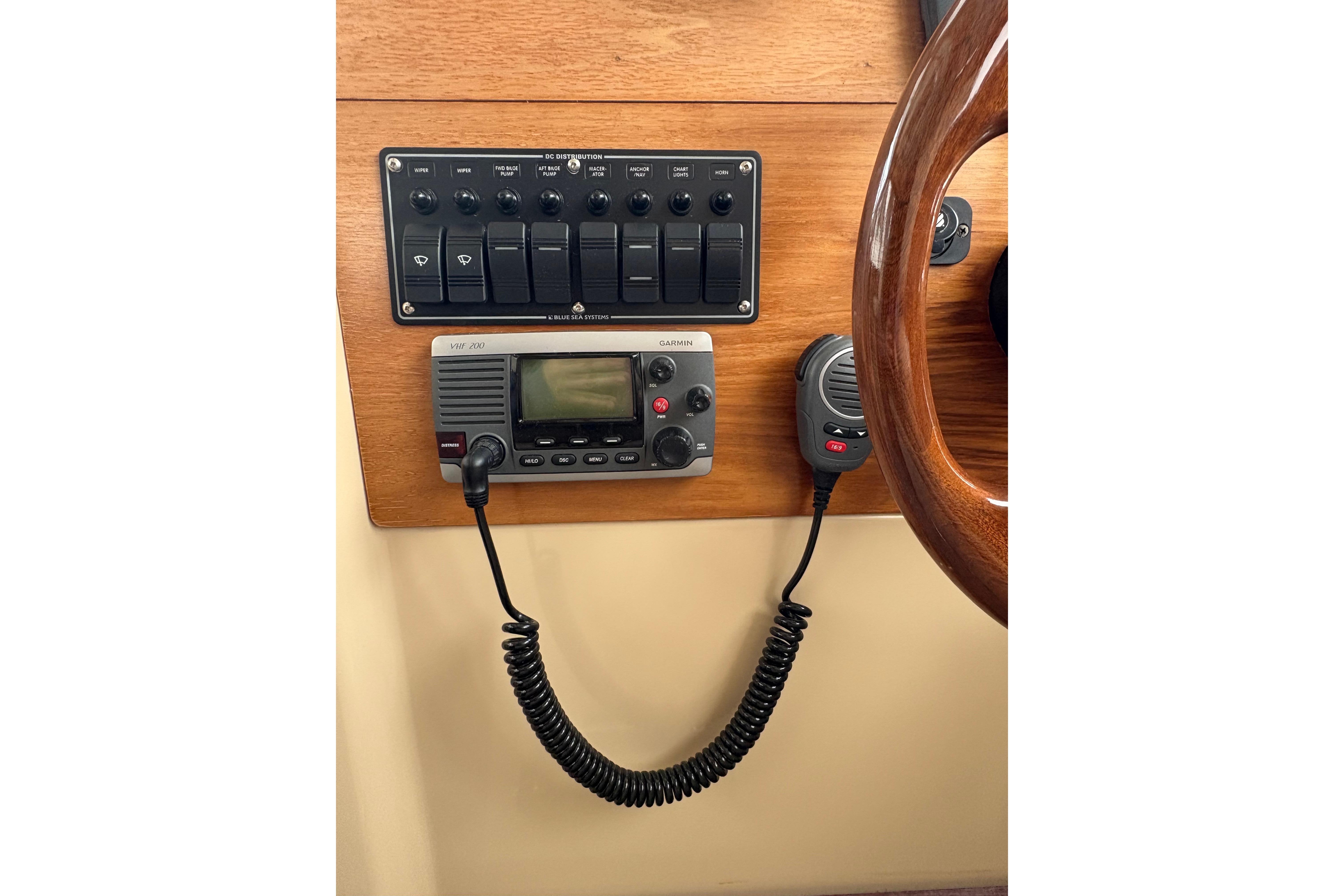 2012 Cutwater C-26 boat dashboard with control panel and VHF radio.