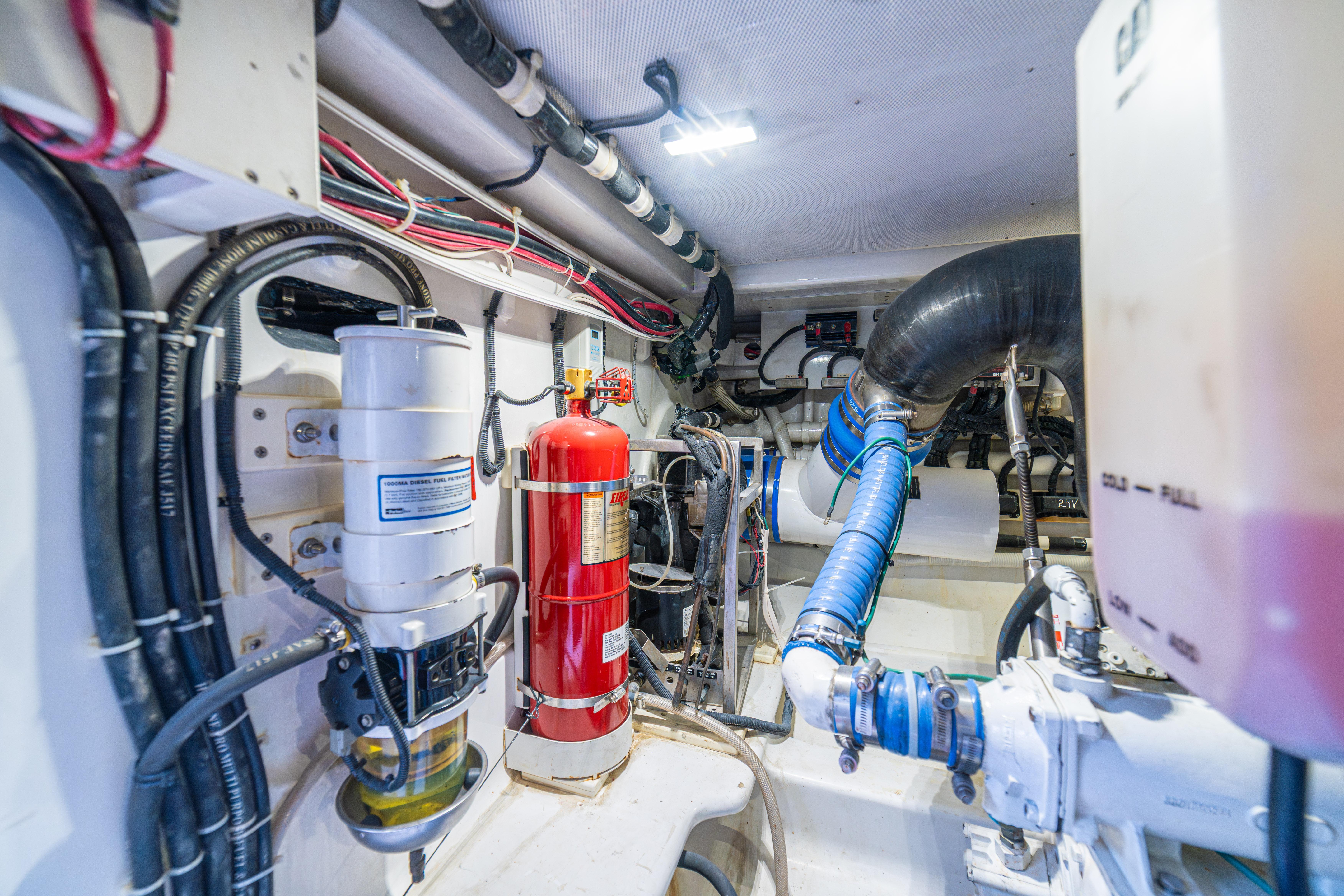 Engine room of 2020 Maverick Yachts Costa Rica 50 Sportfish, showcasing equipment and wiring.